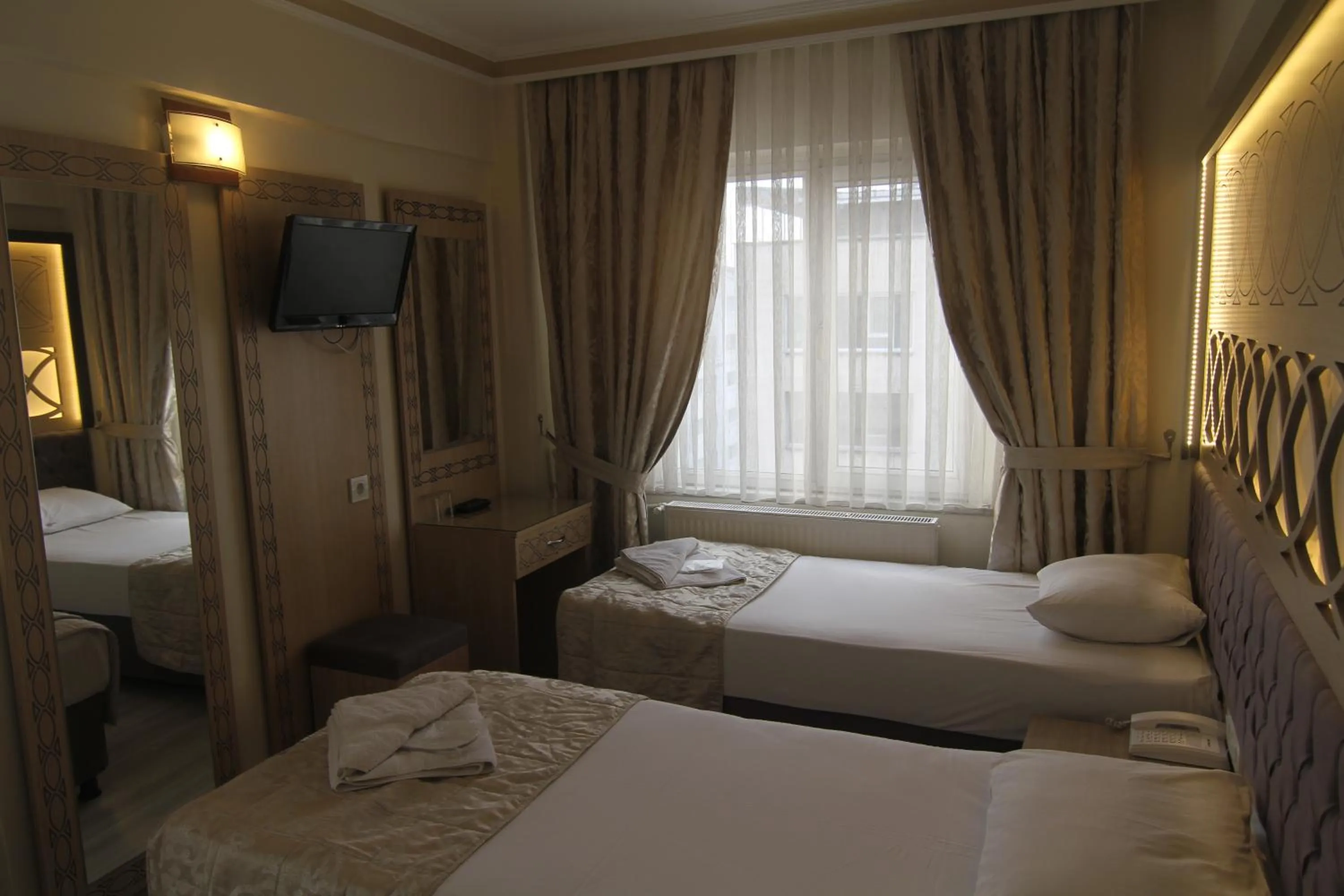 Bed in Grand Liza Hotel