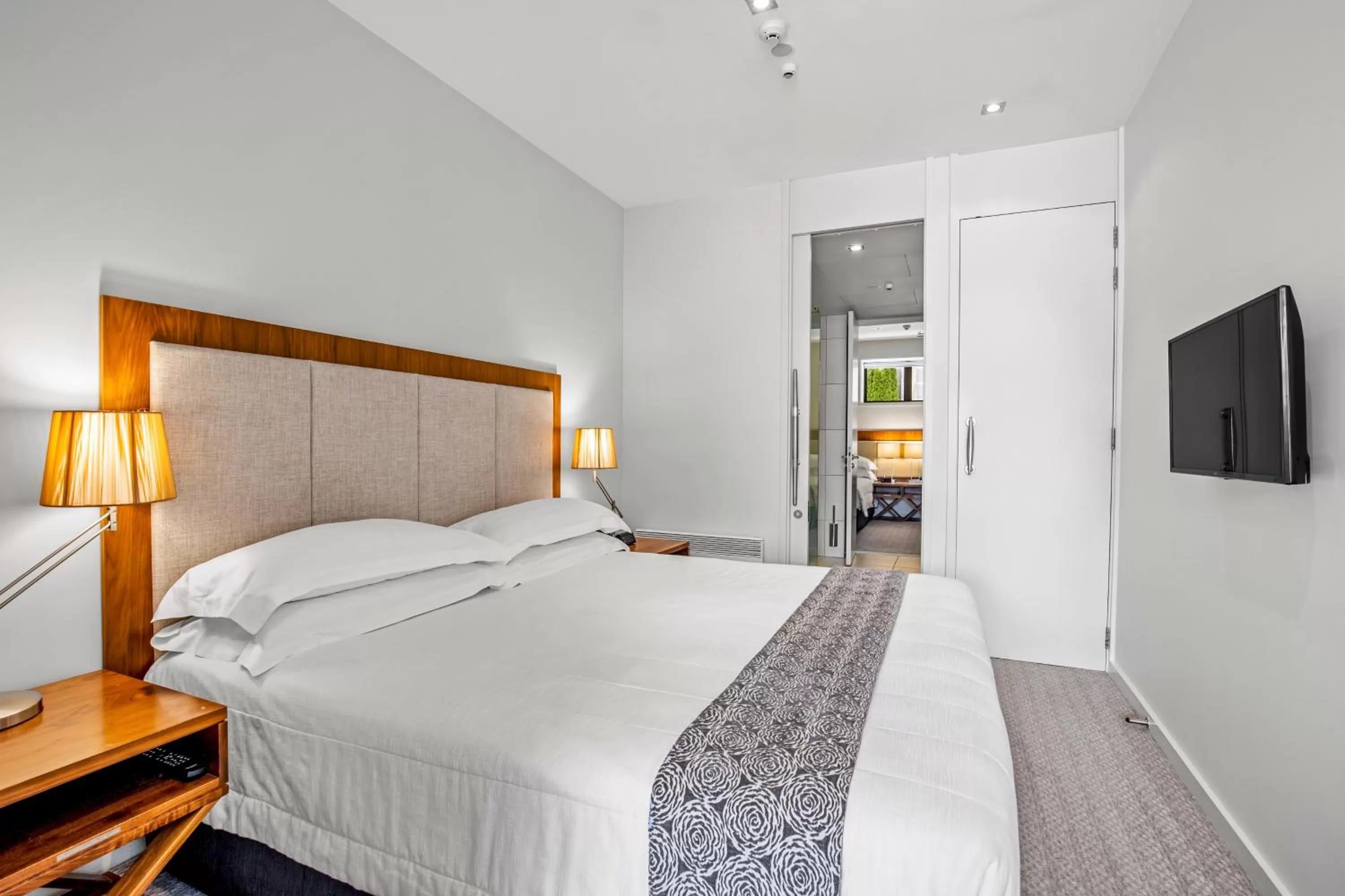 Bed in The Rees Hotel & Luxury Apartments