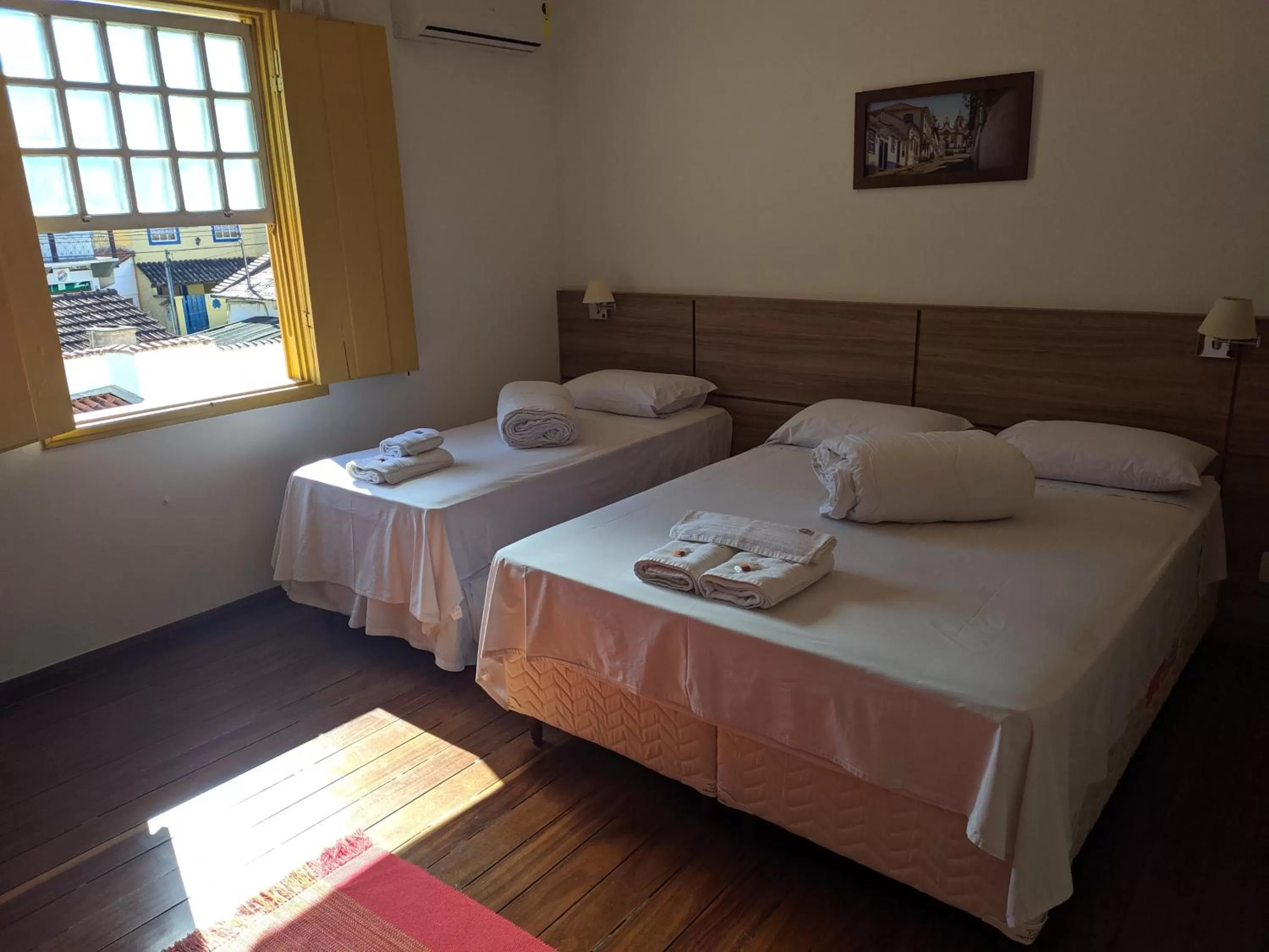 Bed in Pousada o Amanhecer