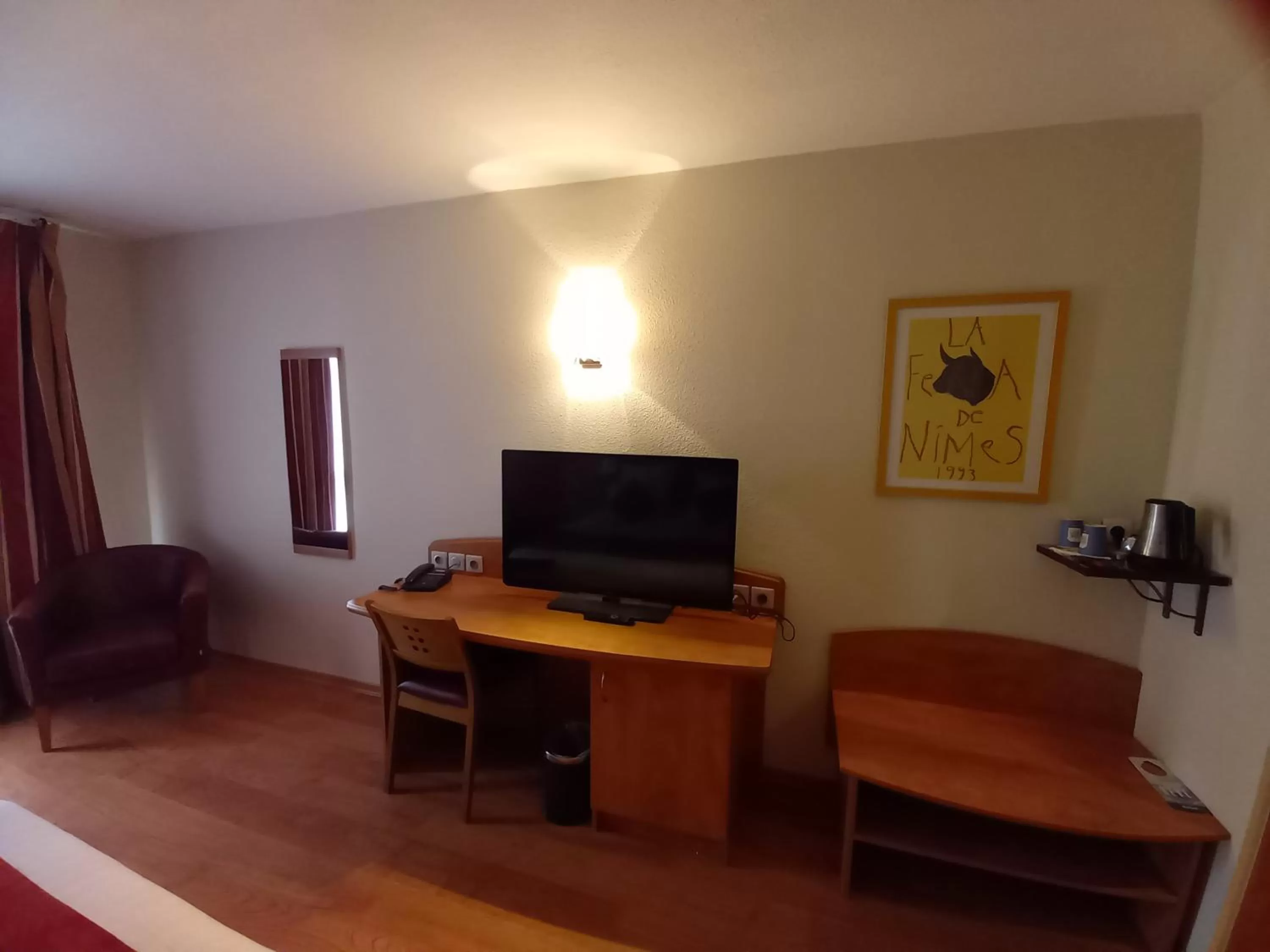 Seating area in Kyriad Nîmes Ouest A9