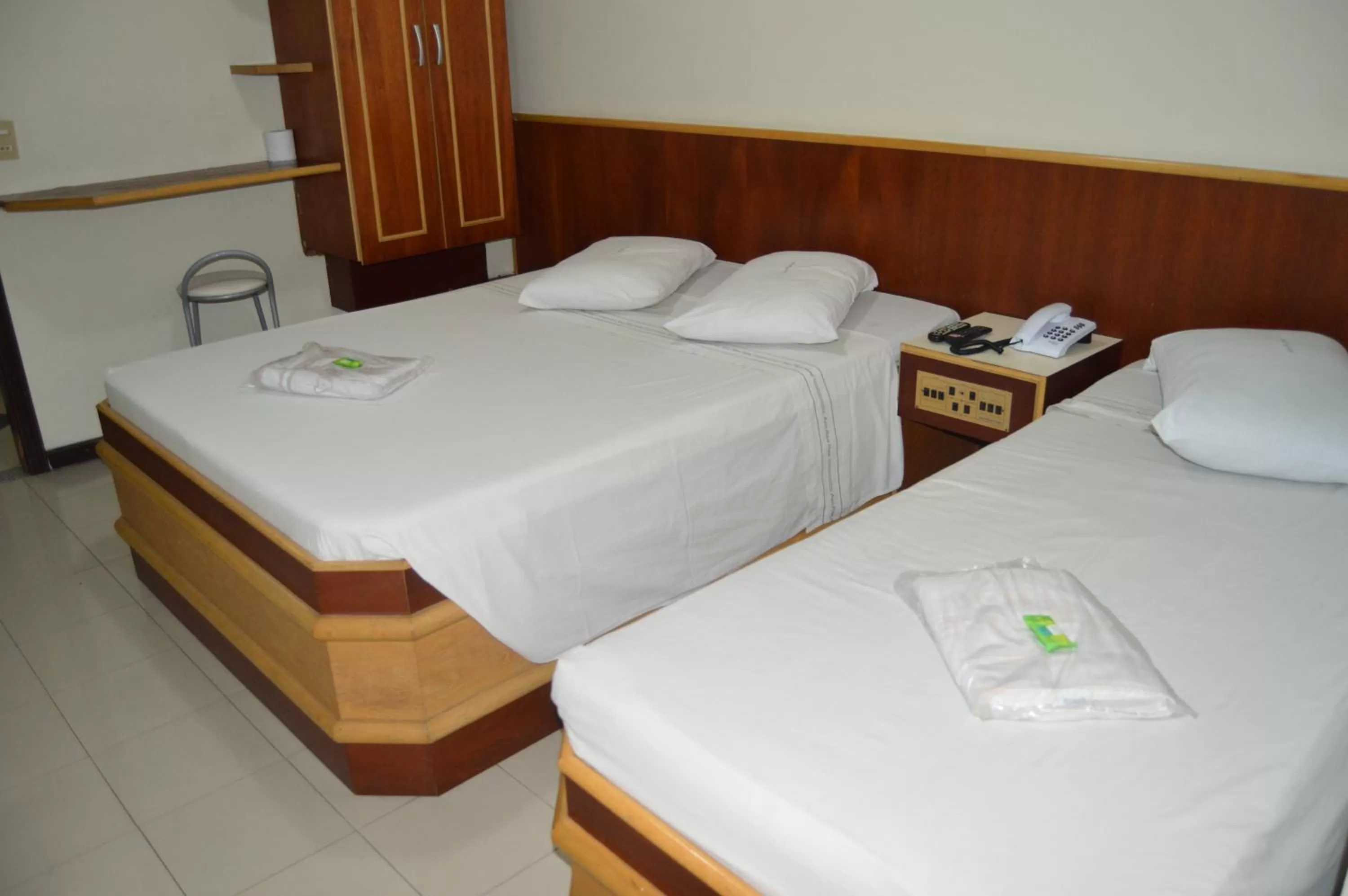 Bed in Aero Plaza Hotel