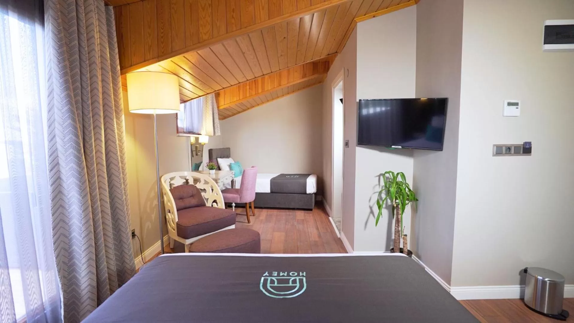 Bed in Homey AirPort Hotel