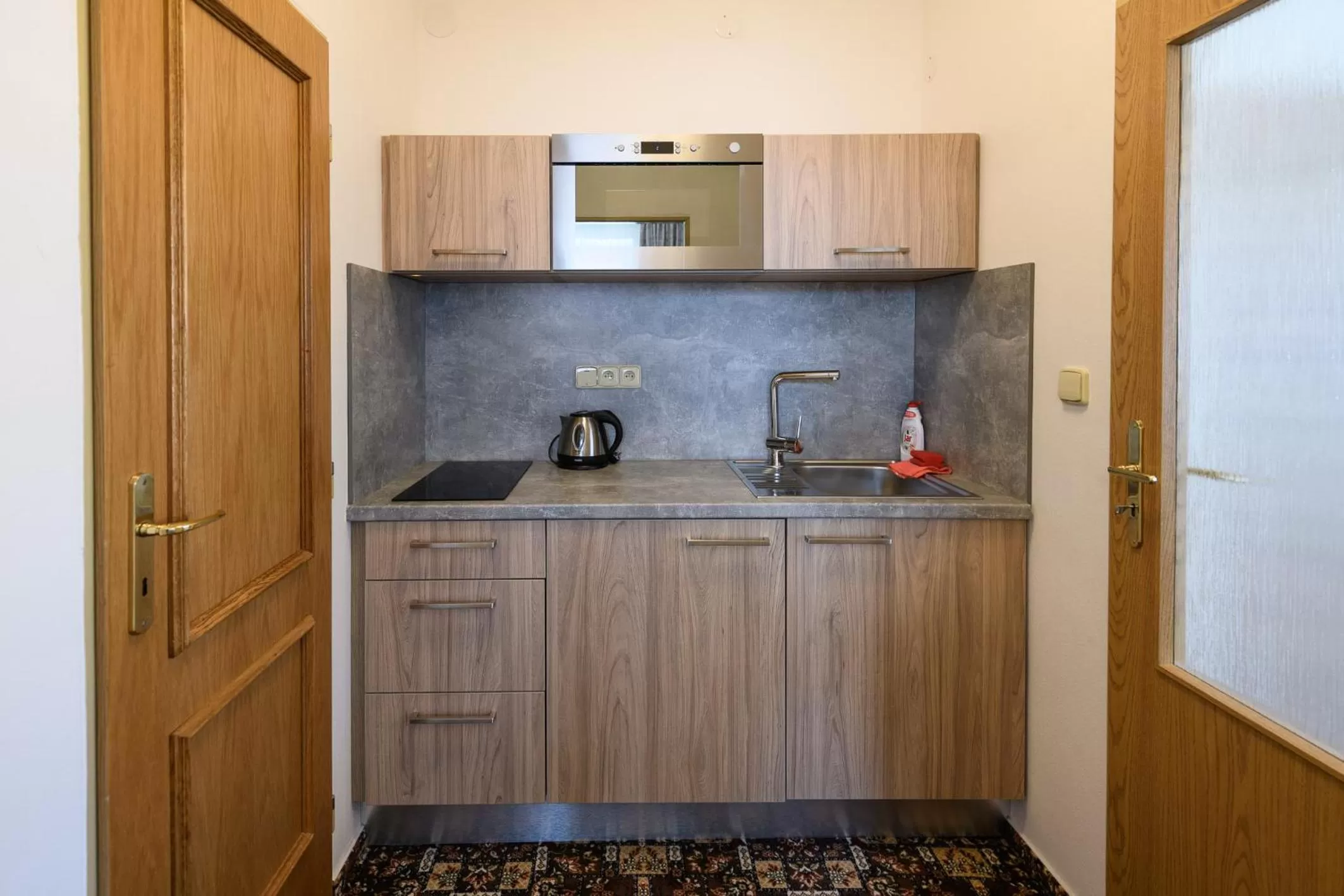 Kitchen or kitchenette in Sport-V-Hotel