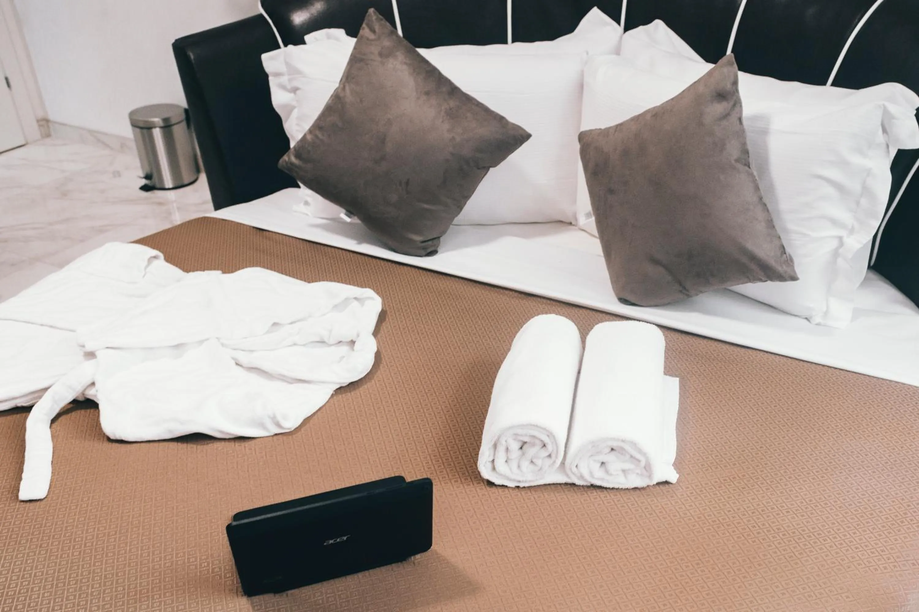 Bed in Gregorio VII Luxury Suites San Damaso