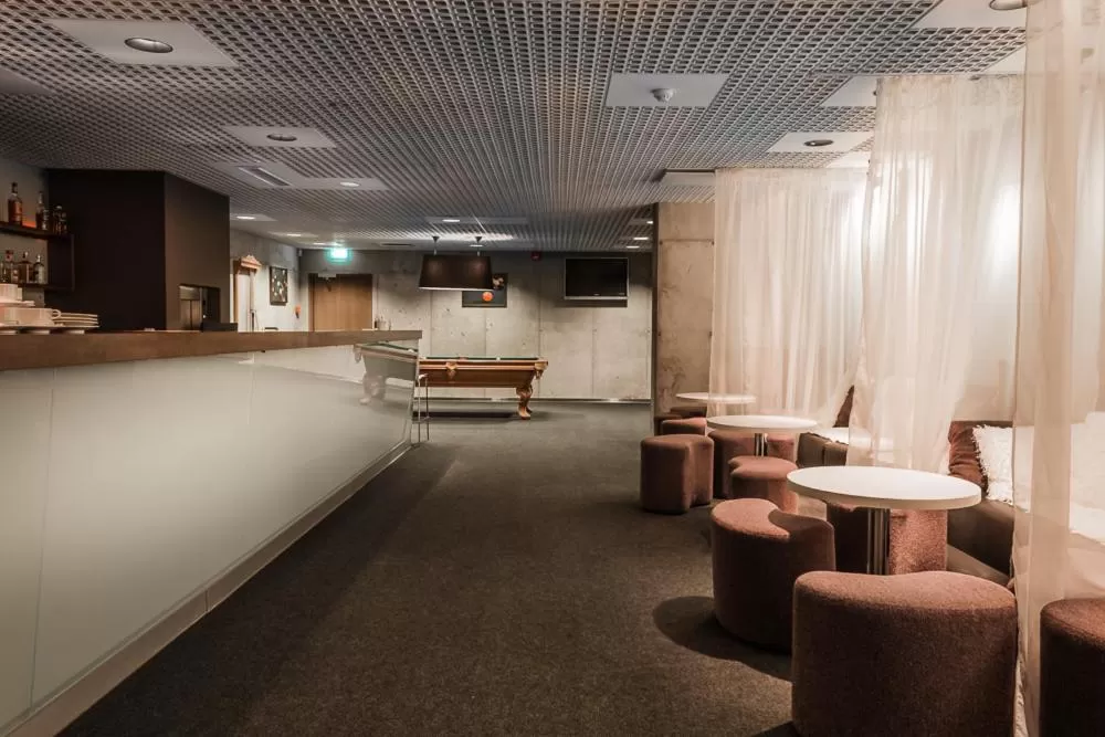 Communal lounge/ TV room in Johan Design & SPA Hotel