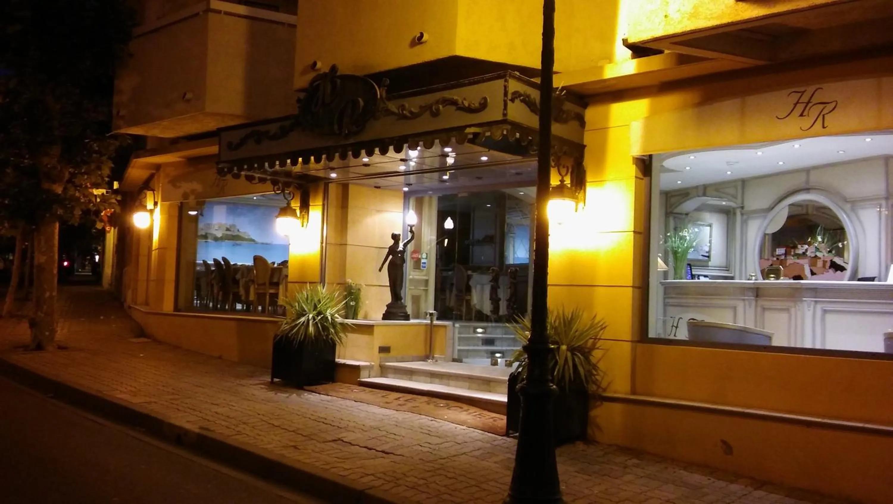 Property logo or sign in Hôtel Le Rocher