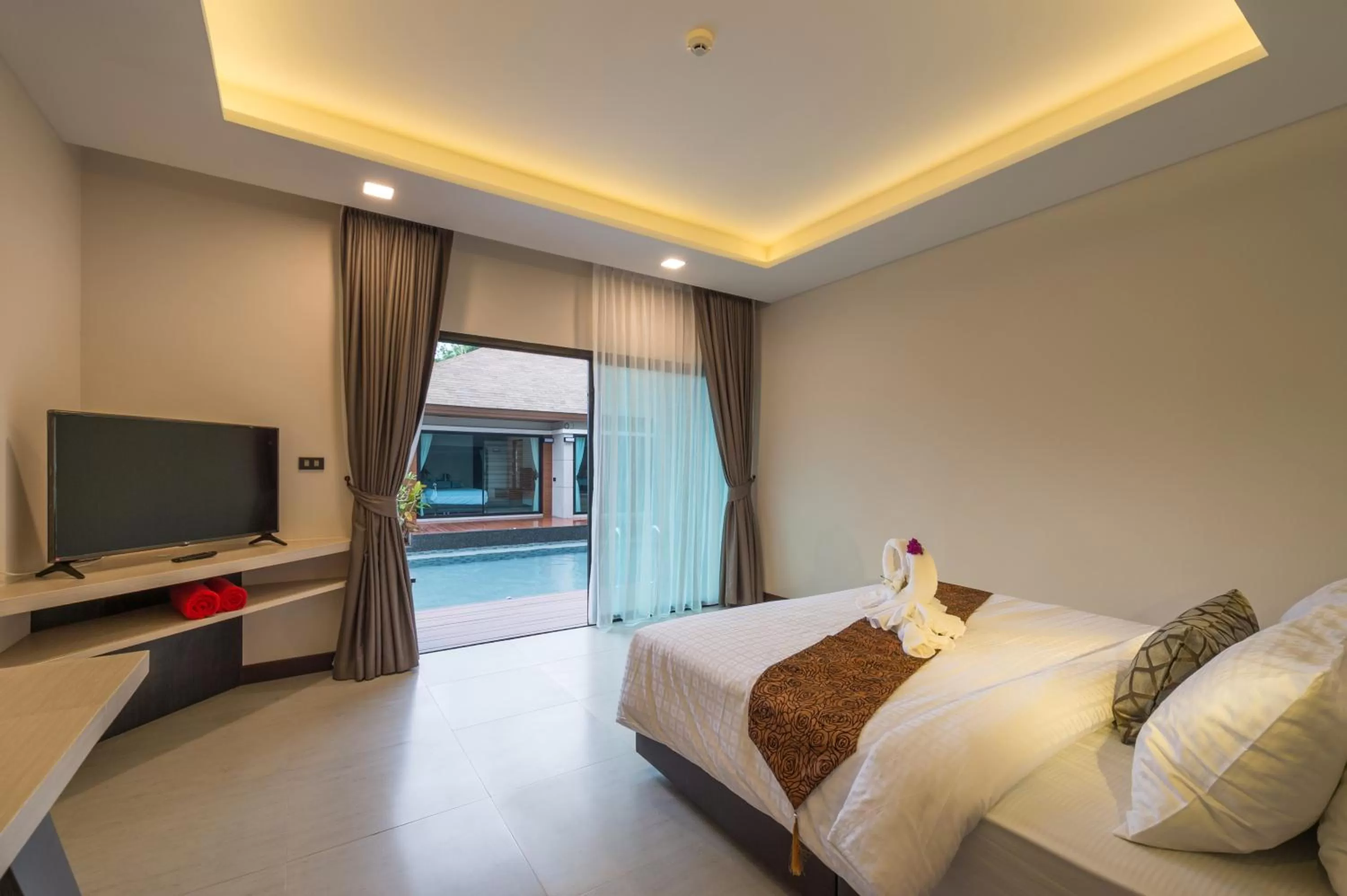 Bed in Cher​mantra​ Aonang​ Resort & Pool​ Suite