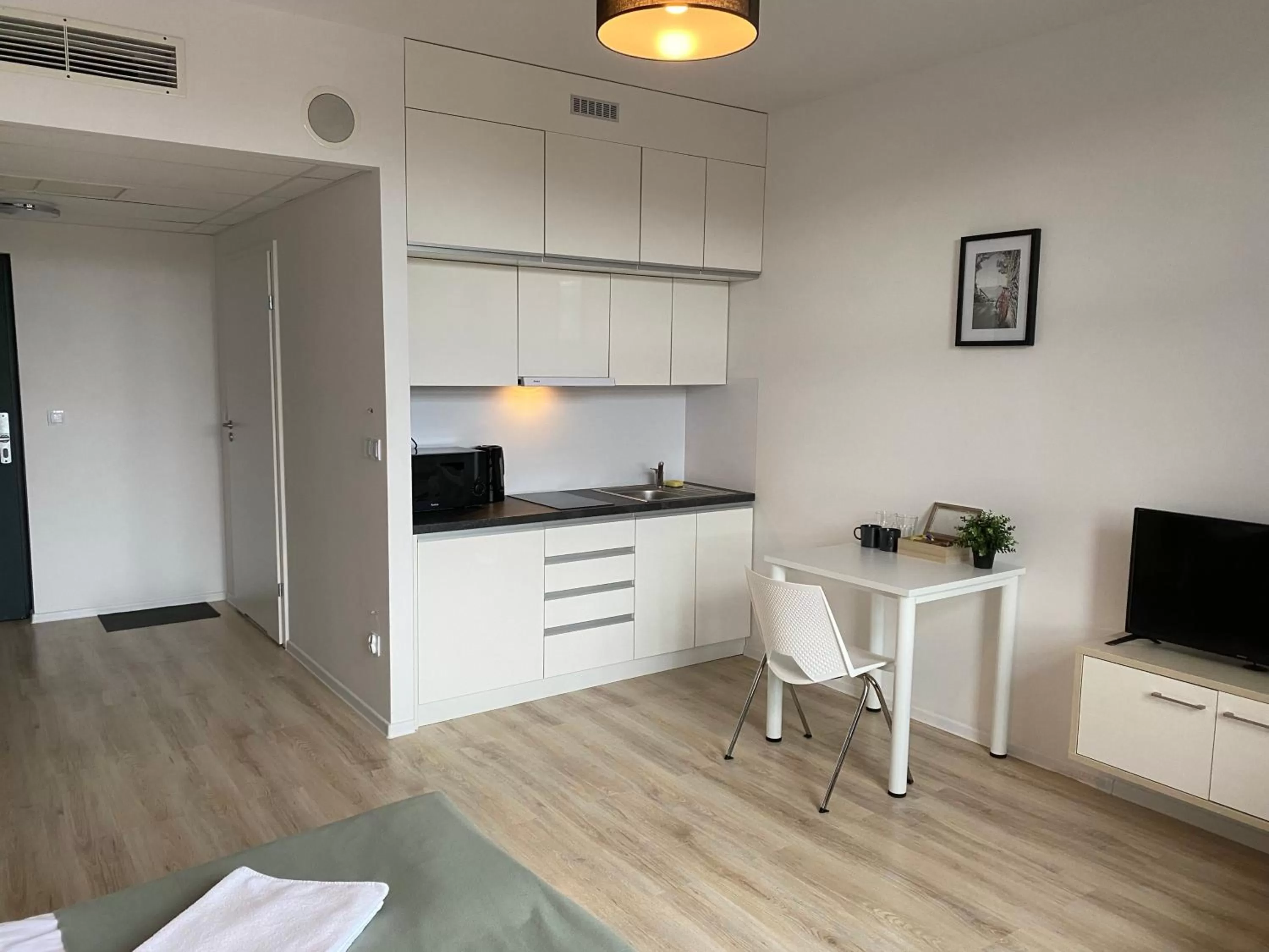 Kitchen or kitchenette in SleepWell Apartments
