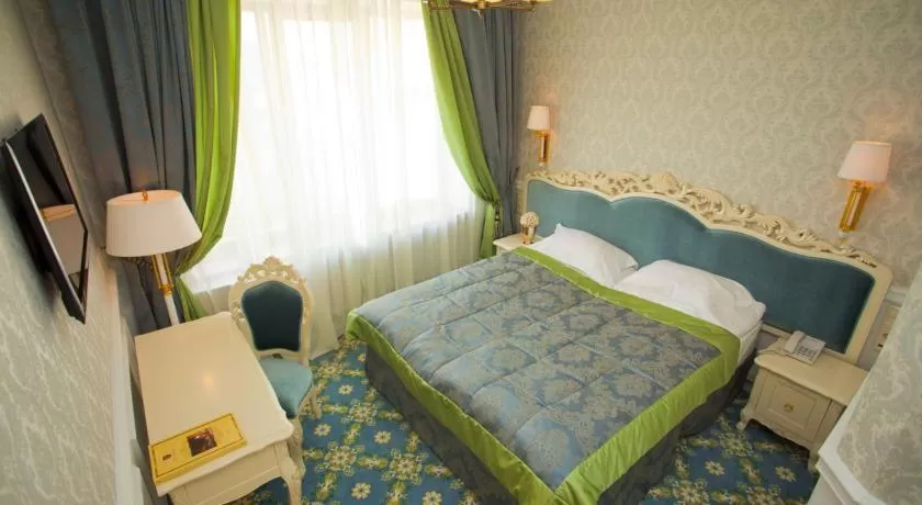 Bed in Royal Olympic Hotel