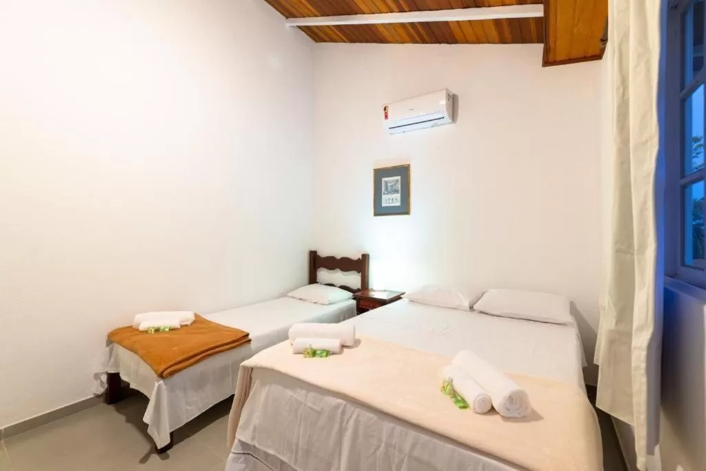 Bed in Pousada Portal de Paraty