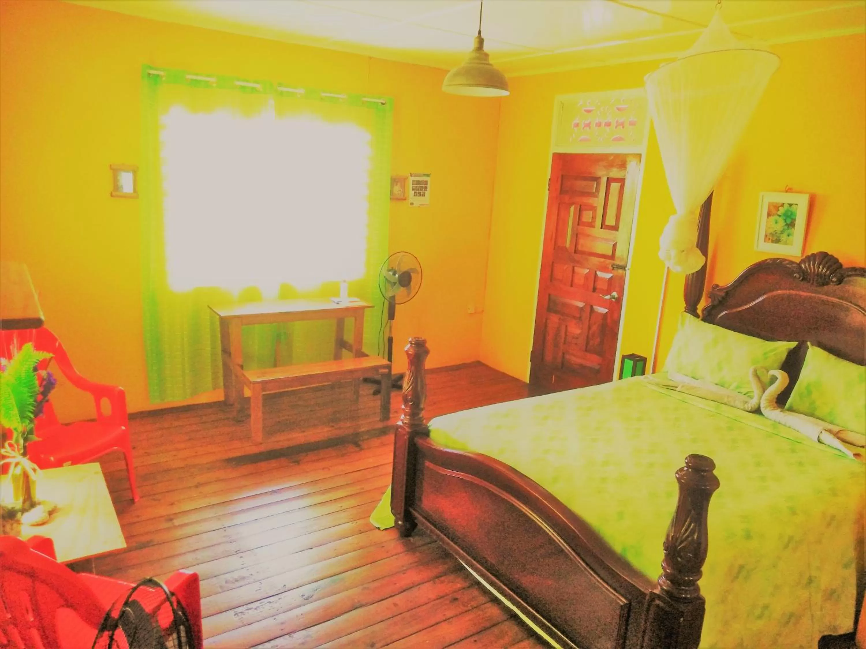 Bed in TOGA GUEST HOUSE