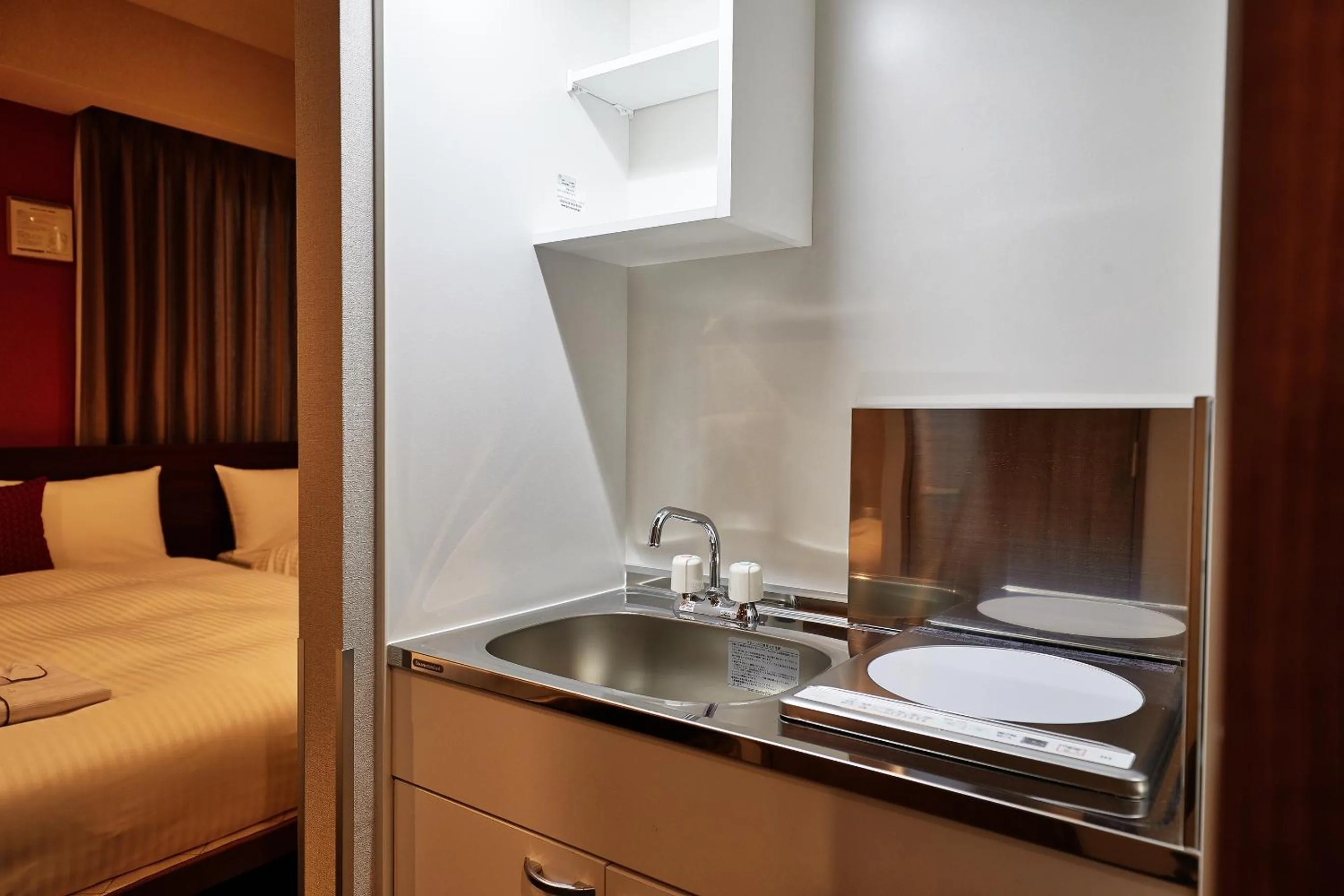 Bed in Y's Inn Naha Oroku Ekimae