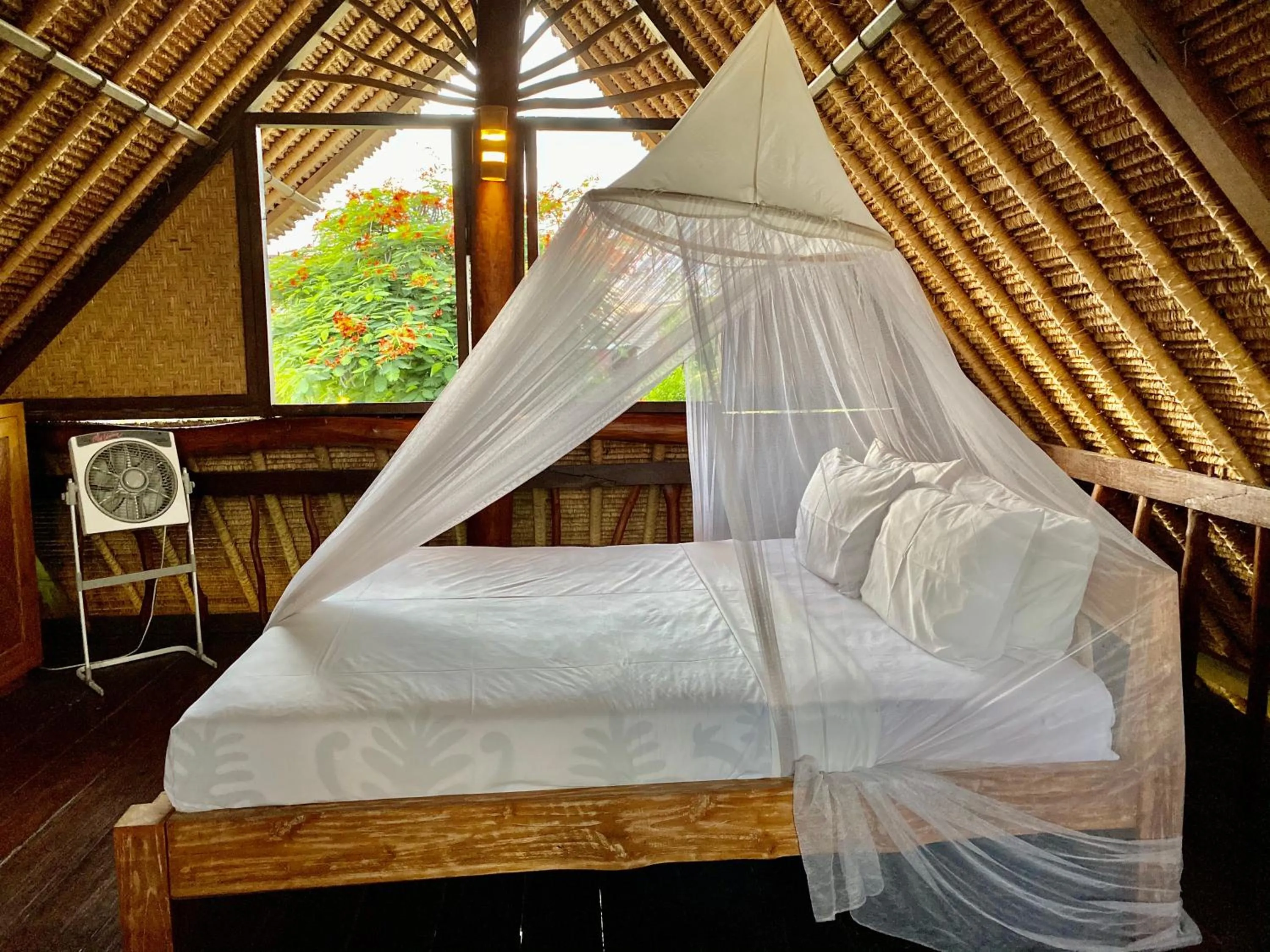 Bed in Flower Bud Bungalow Balangan