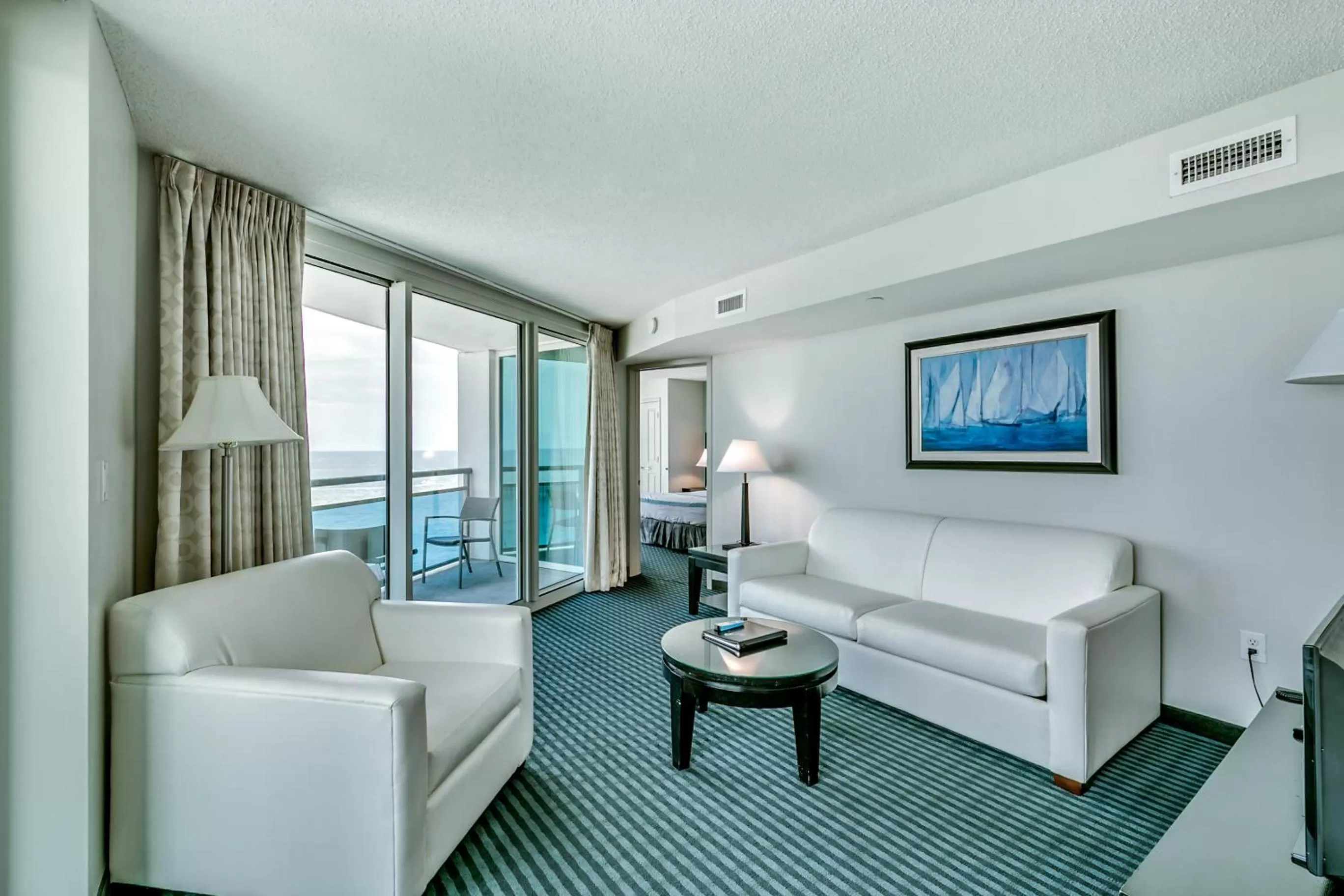 Seating area, Bed in Oceans One Resort