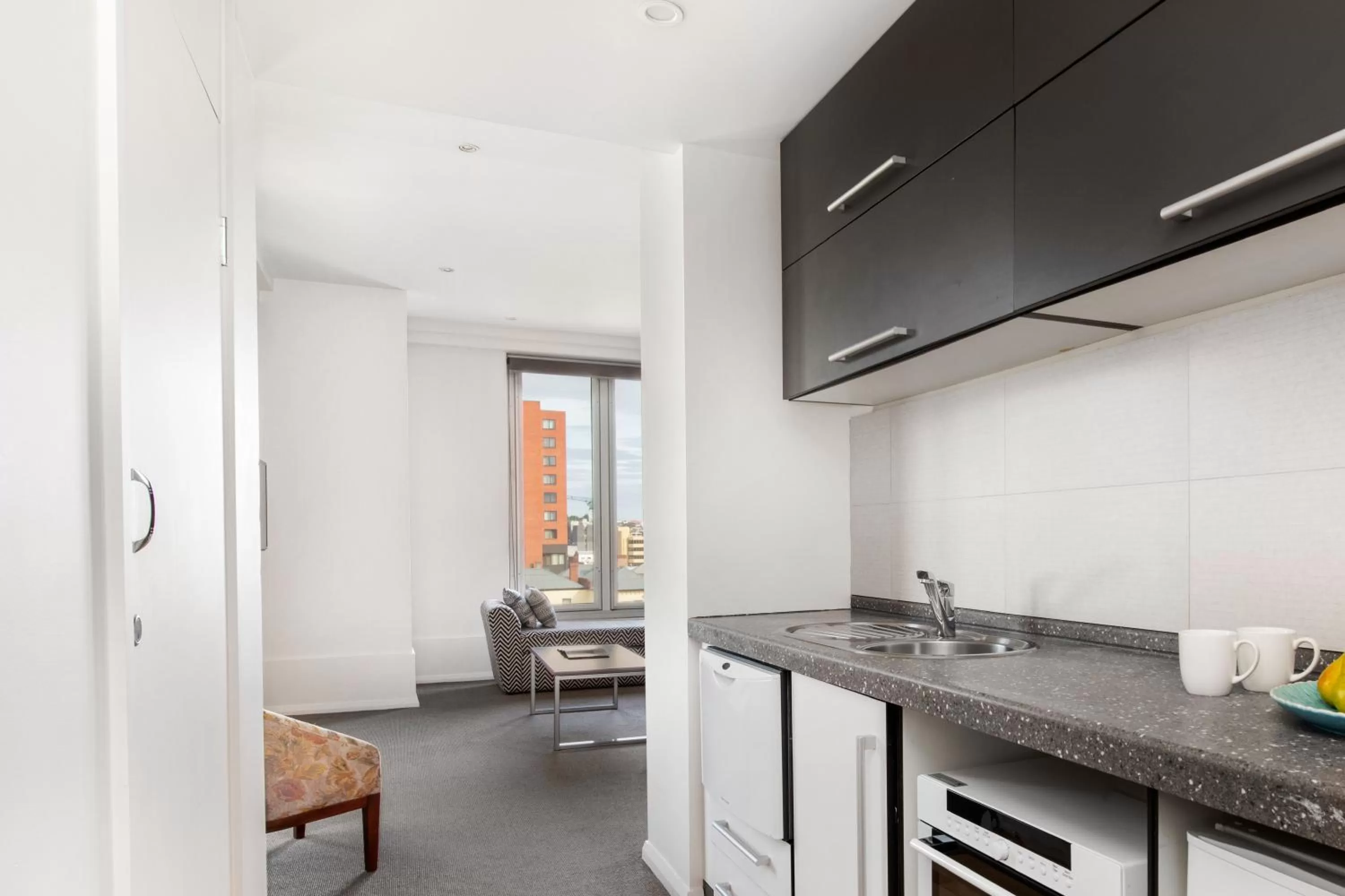 Kitchen or kitchenette in Mantra One Sandy Bay Road