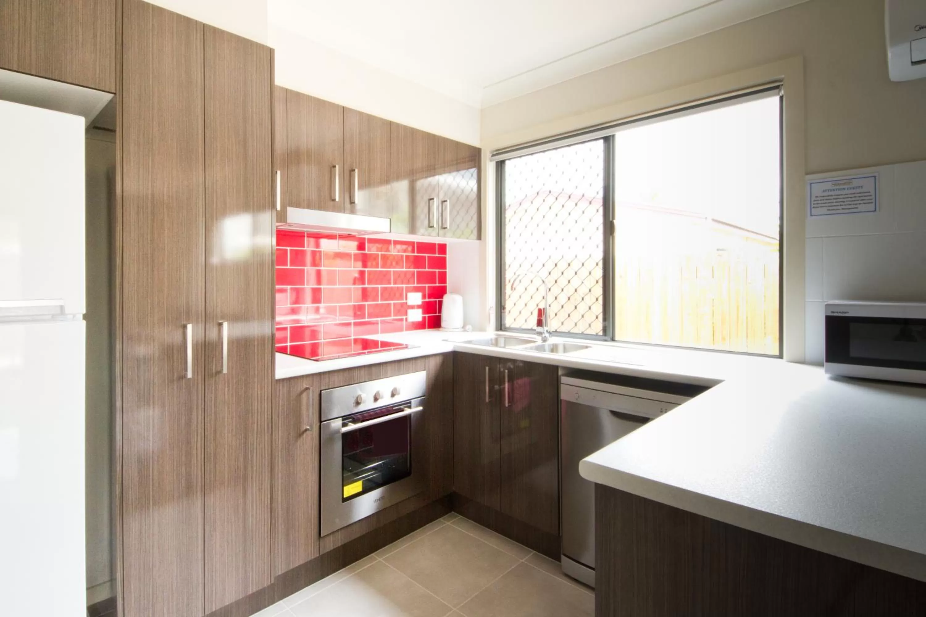 Kitchen or kitchenette in Rockhampton Serviced Apartments