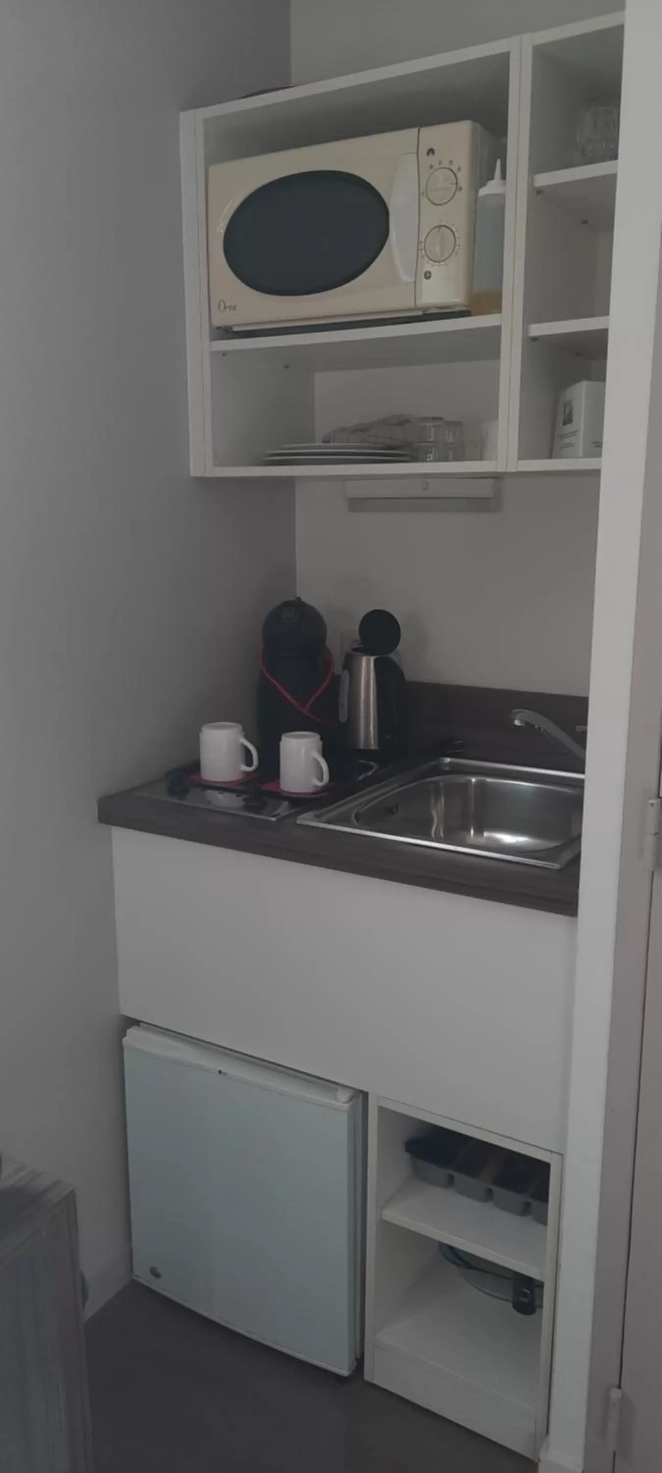 Kitchen or kitchenette in The Originals Residence Appart Hôtel Hévéa Valence