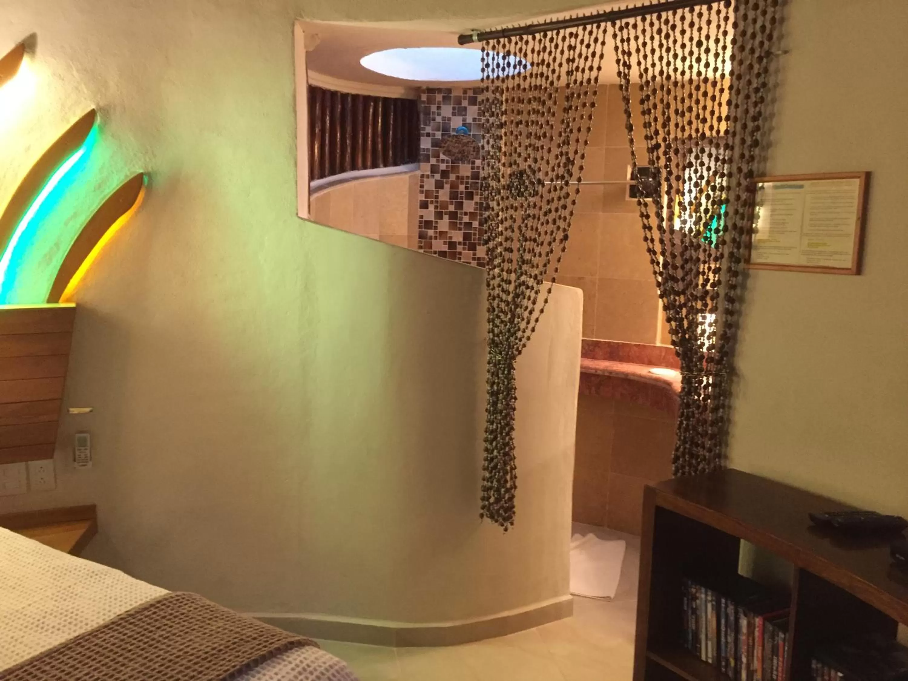 Photo of the whole room, Bed in Cocos Cabañas Playa del Carmen Adults Only