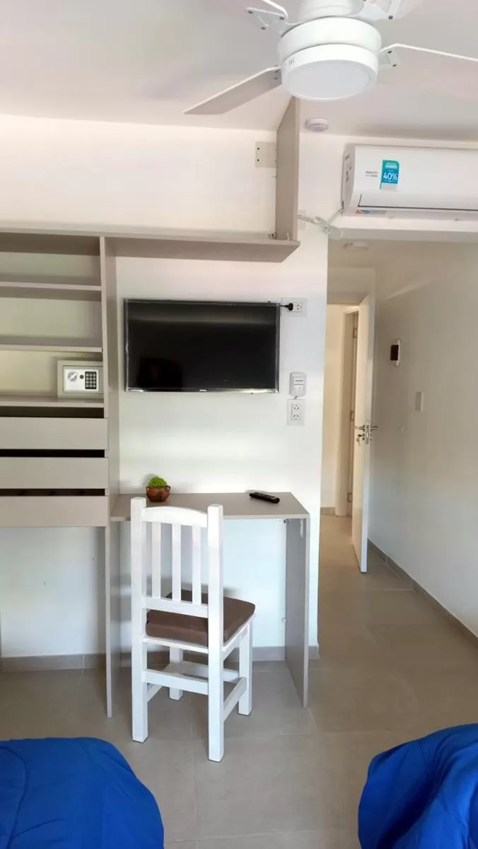 TV and multimedia, TV/Entertainment Center in Hotel Musto