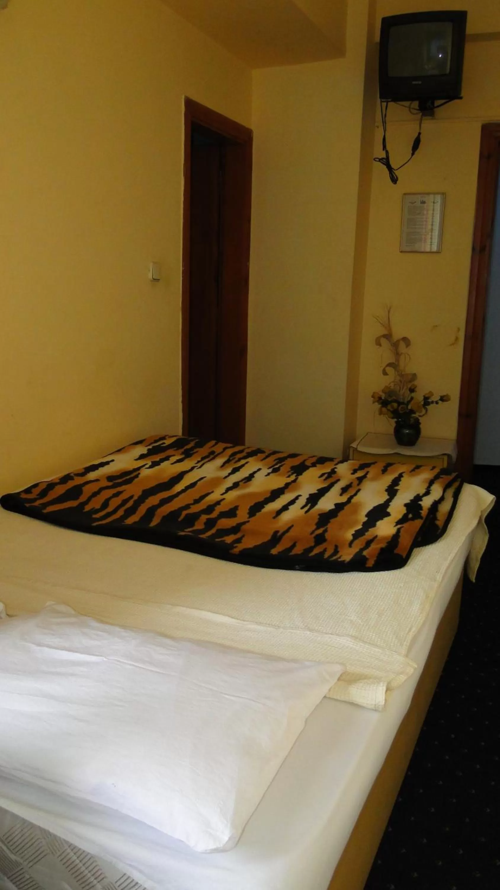 Bed in Sunrise Hotel
