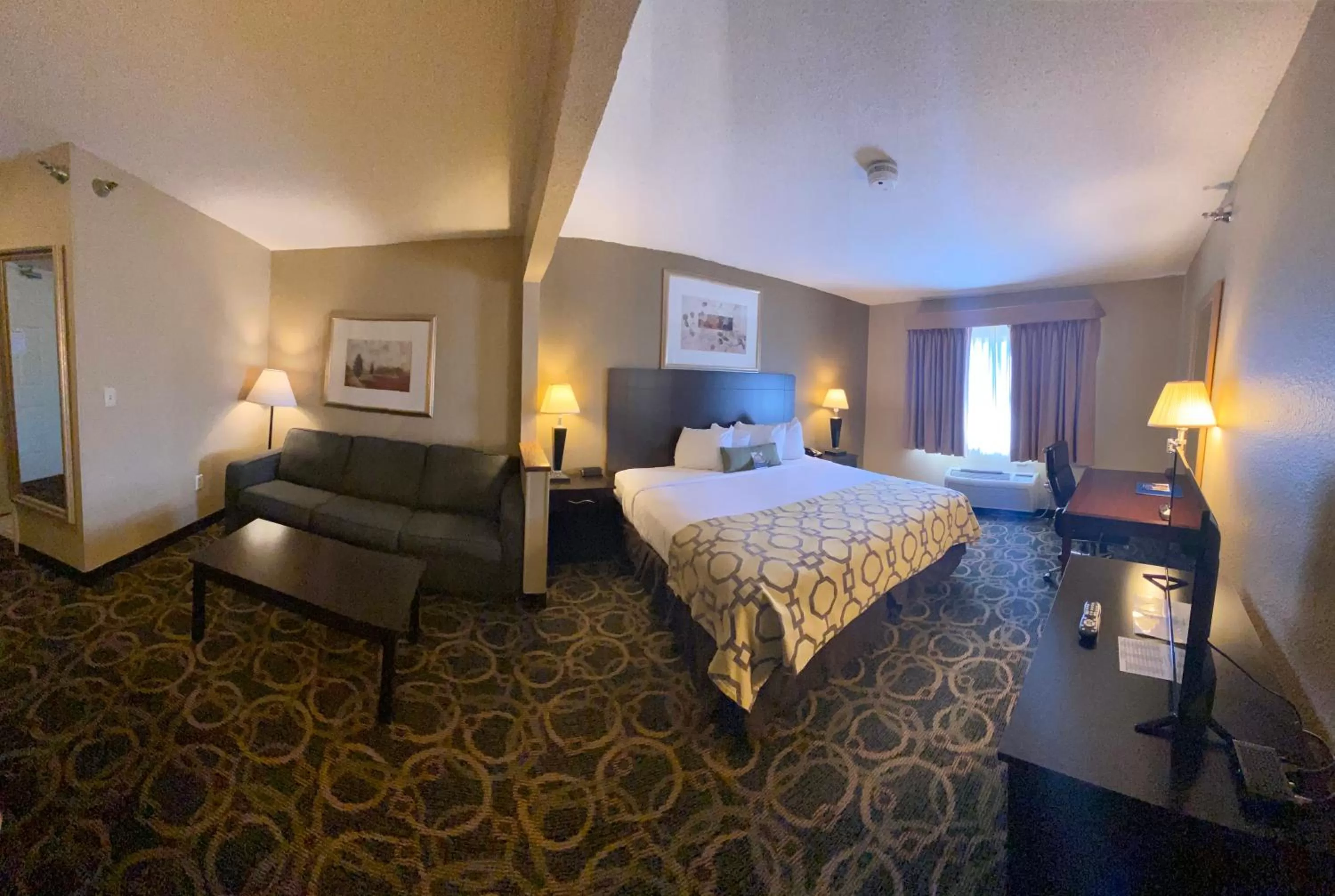 Seating area, Bed in Baymont by Wyndham Casper East