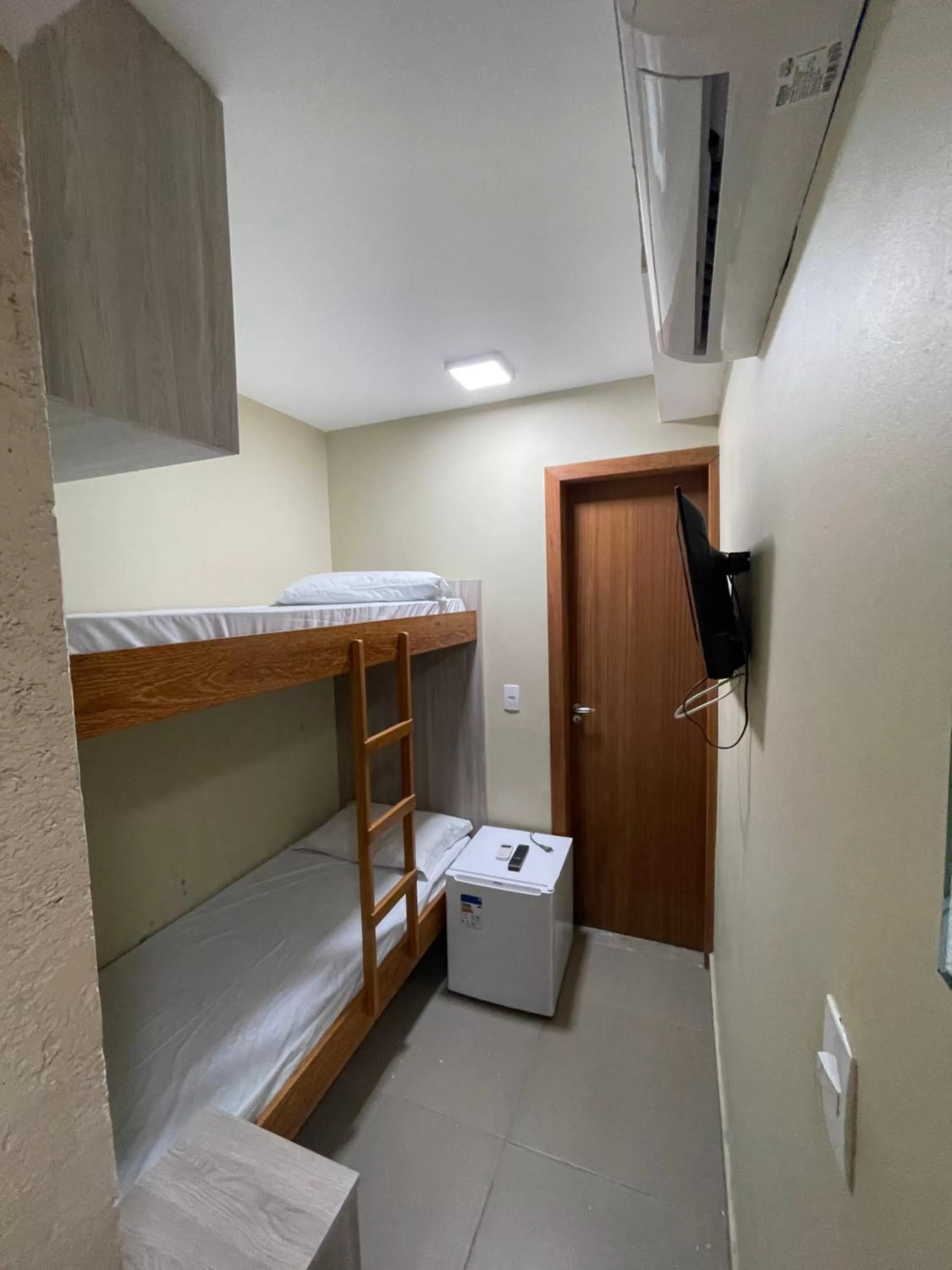 Bed in Pousada Tissiano