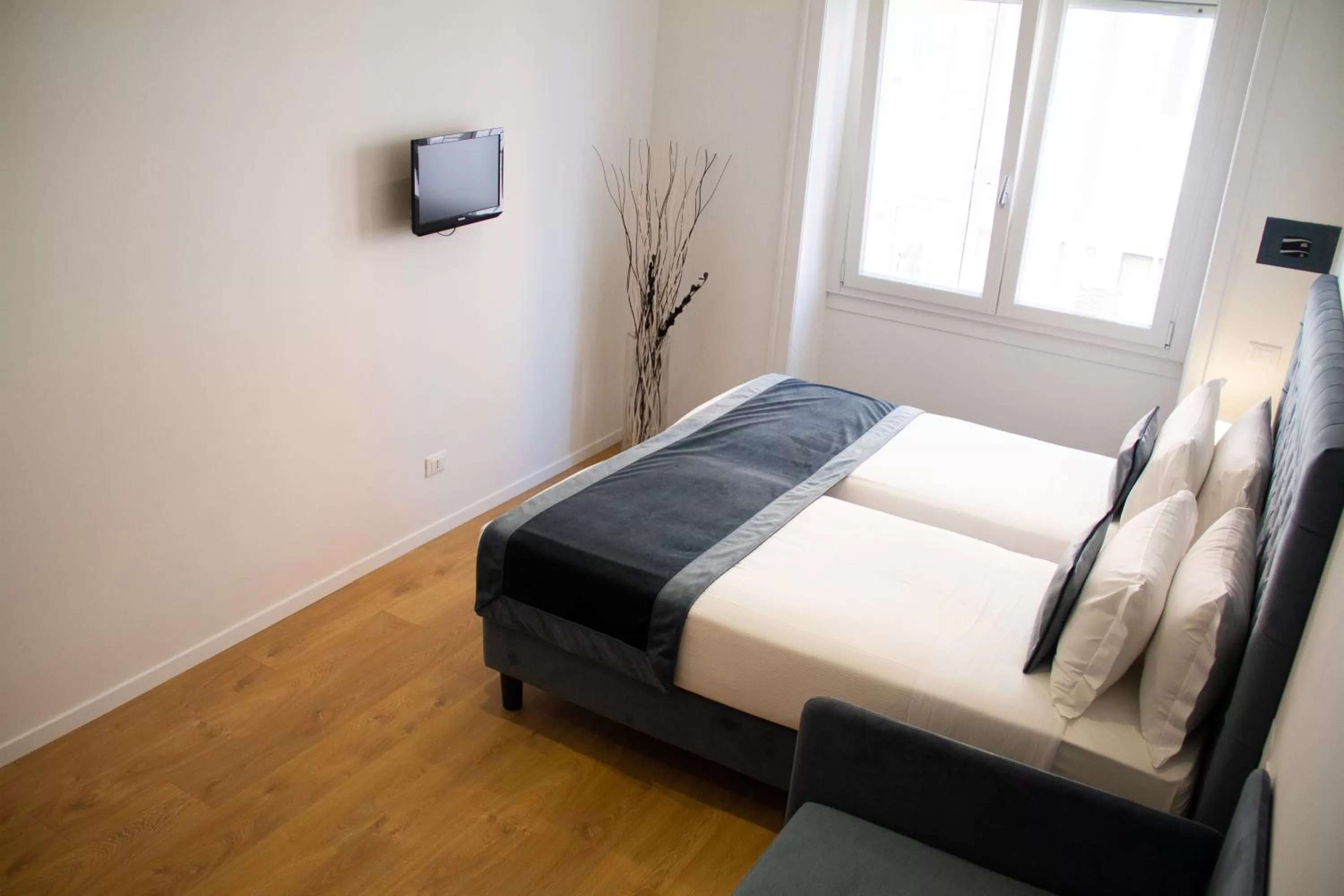 Bed in Michelangelo Vatican Rooms