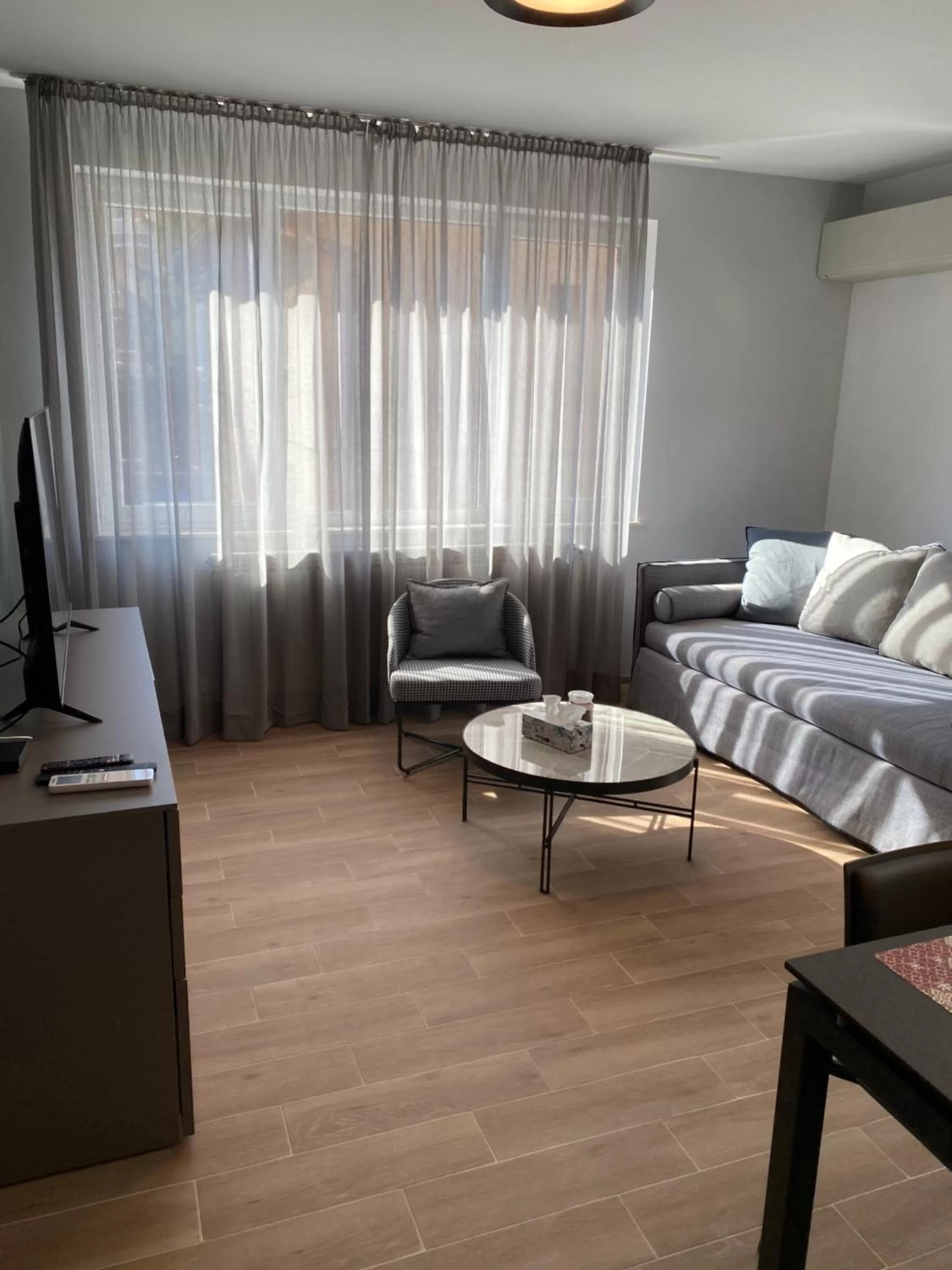 Bed, Seating Area in 7th Sense boutique apartments