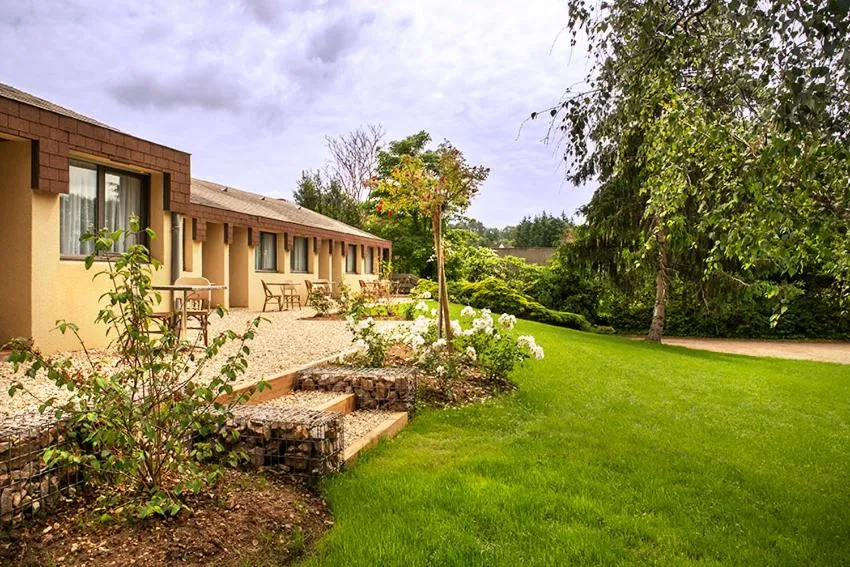 Garden in Logis Hôtel Restaurant Du Lion D'argent Et Des Tanneries