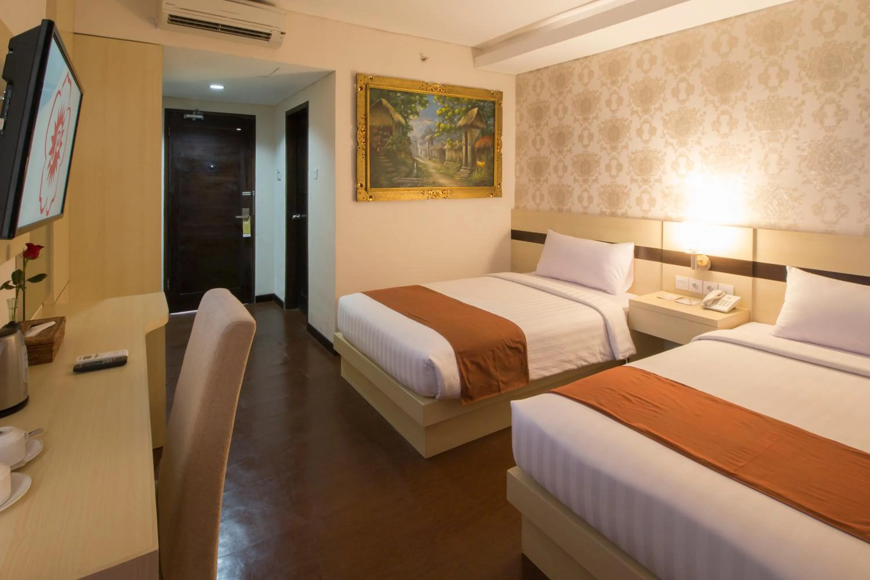 Bed in Grand Puri Saron Hotel Yogyakarta