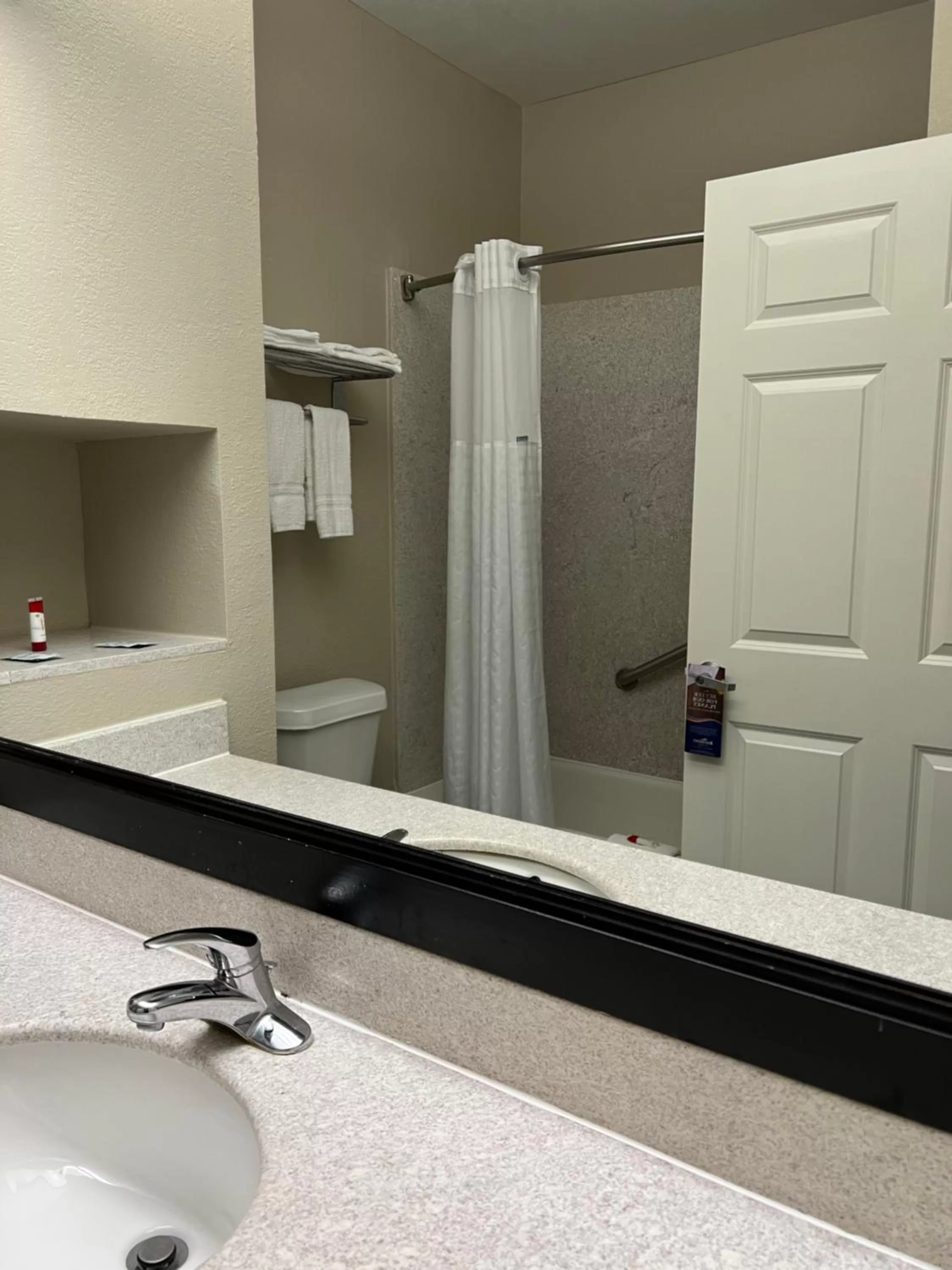 Bathroom in Baymont by Wyndham Houston Brookhollow