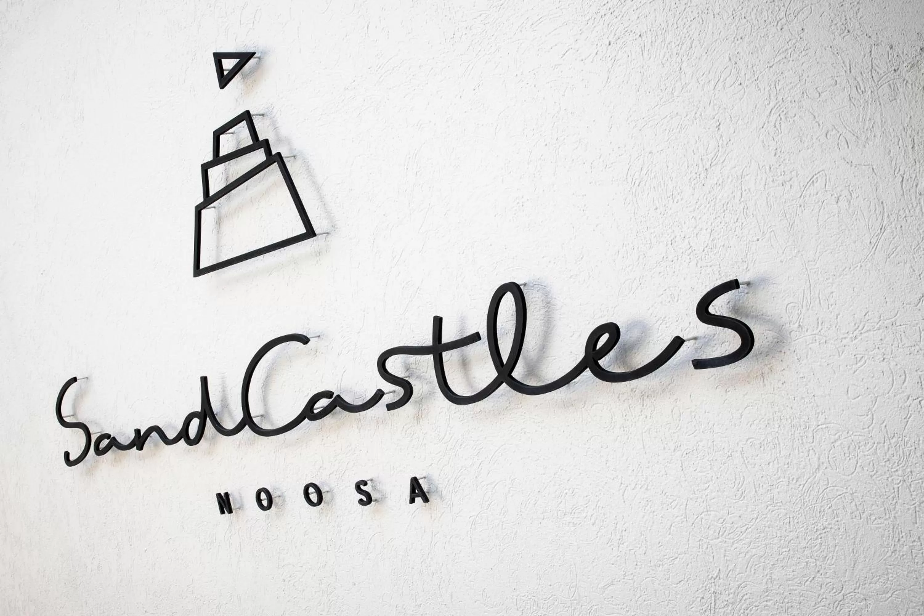 Property logo or sign in SandCastles Noosa