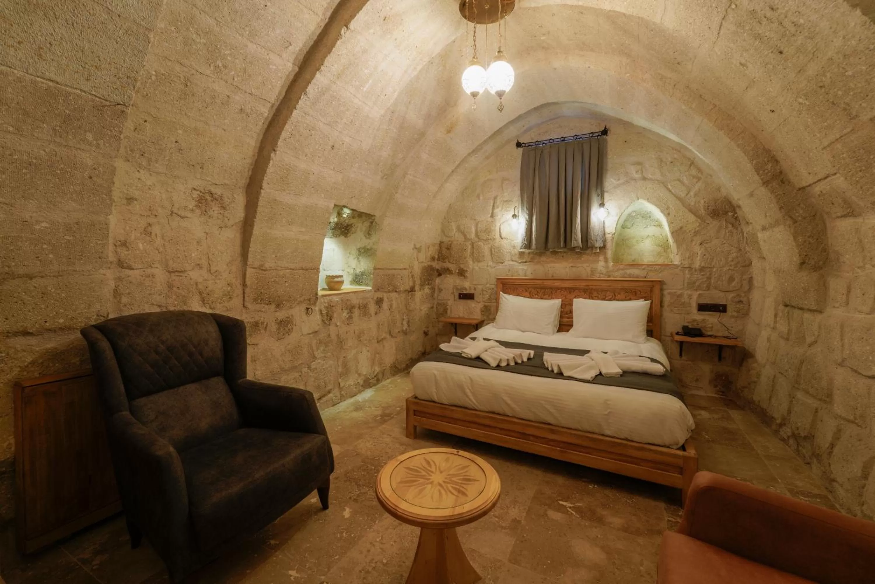 Seating area, Bed in Göreme Escape Cave