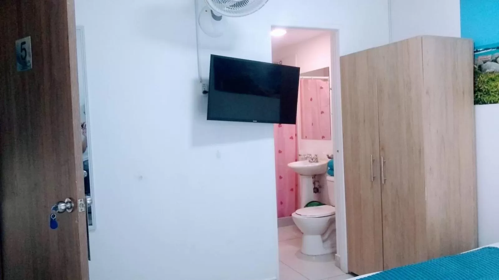 Bathroom, TV/Entertainment Center in Air Guest House