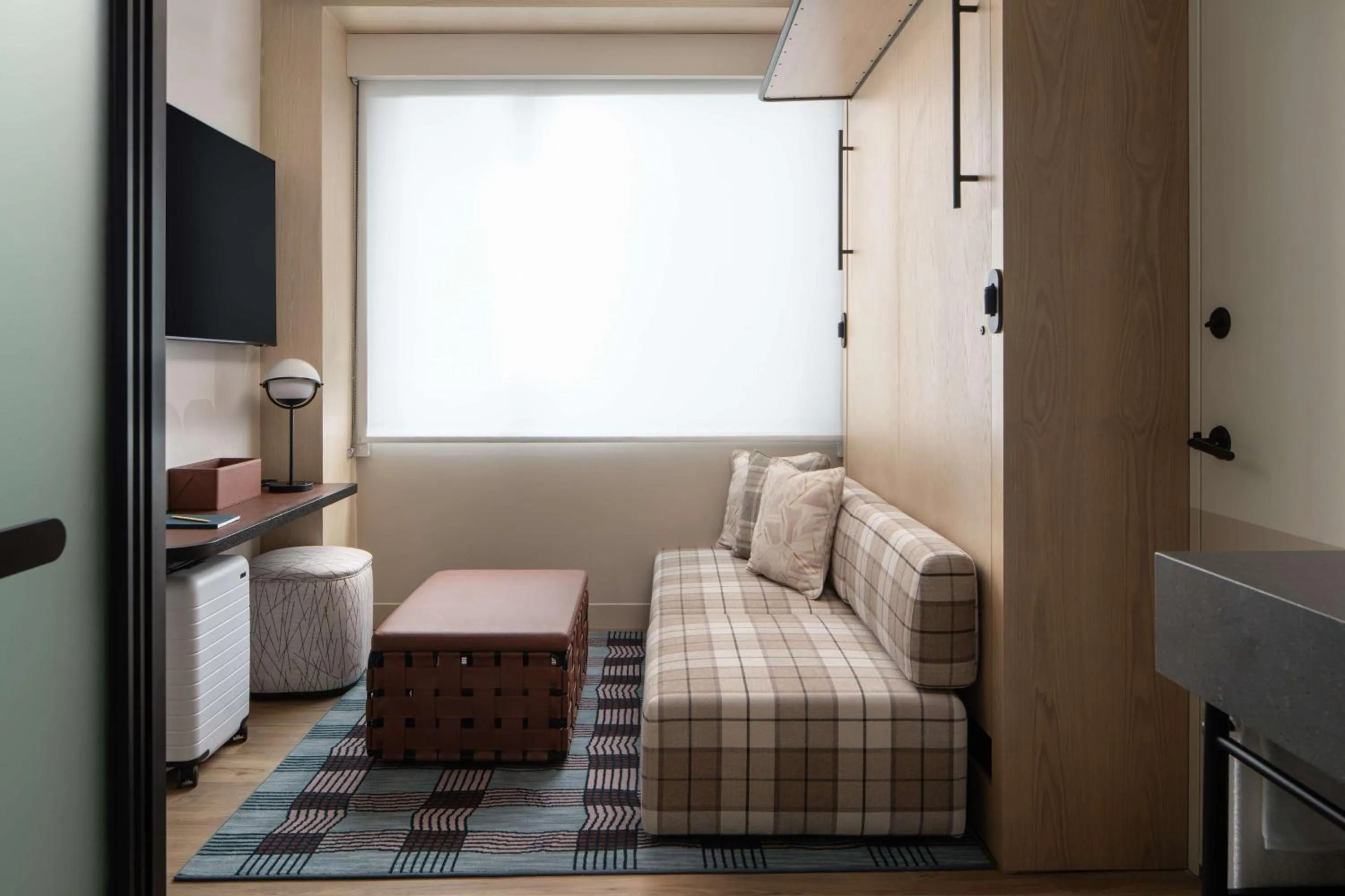 Living room, Bed in Motto By Hilton New York City Times Square