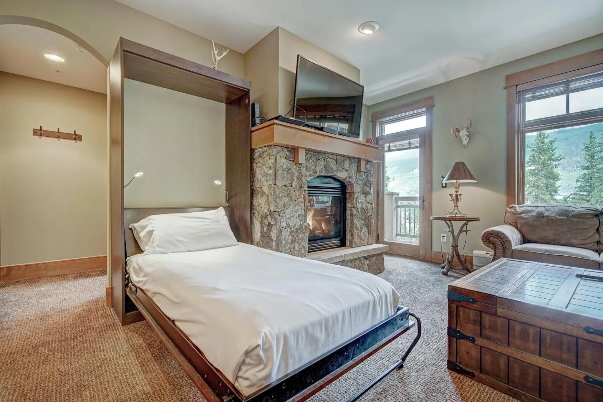 Living room, Bed in Timbers & Lone Eagle by Vail Resorts