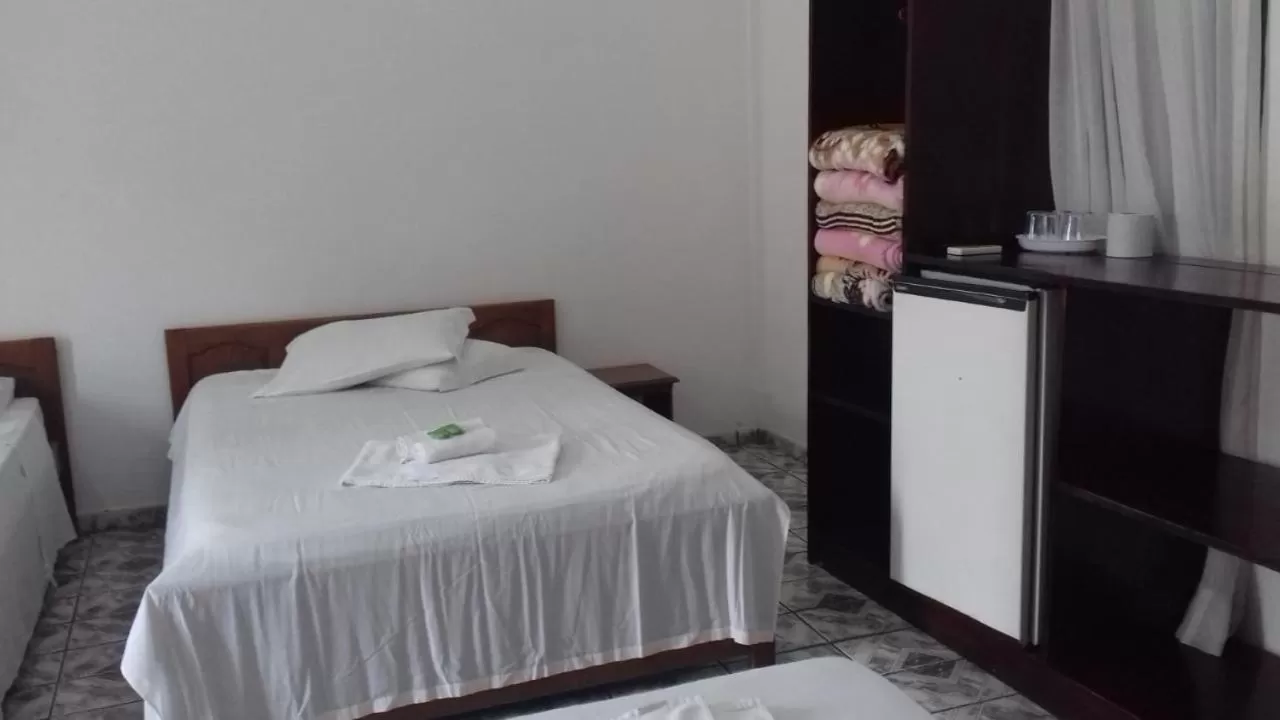 Bed in Pousada Oliveira