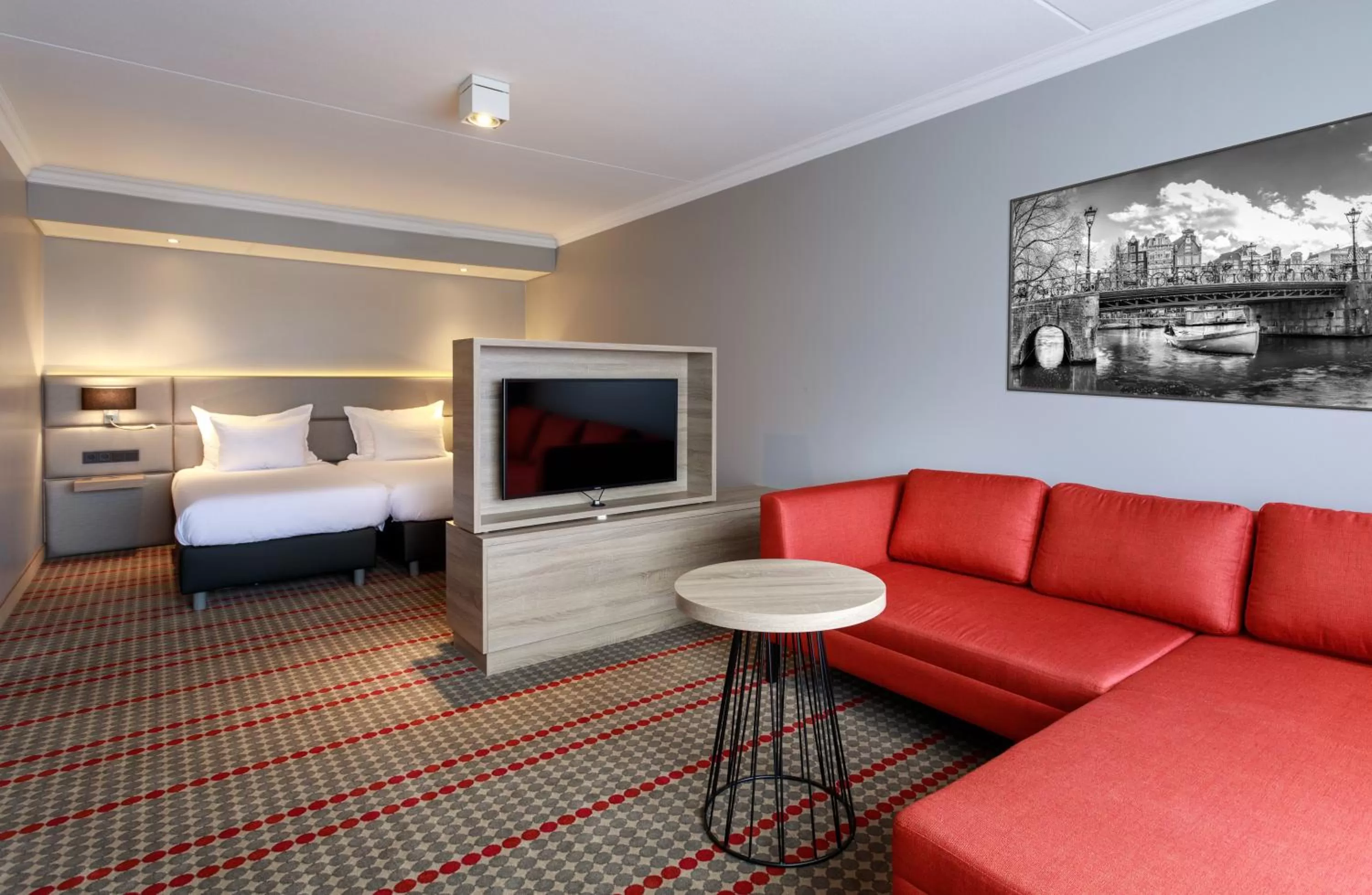 Seating area, Bed in Ramada by Wyndham Amsterdam Airport Schiphol