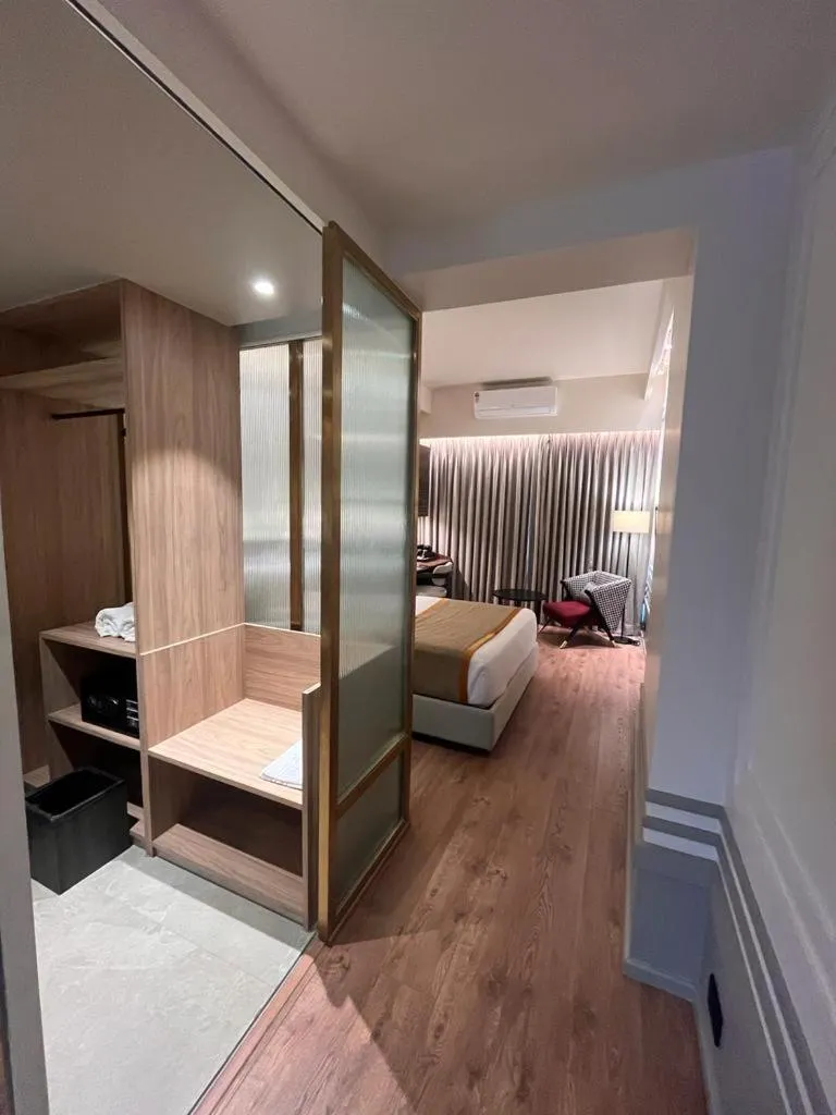 Bed in Hotel Poonja International