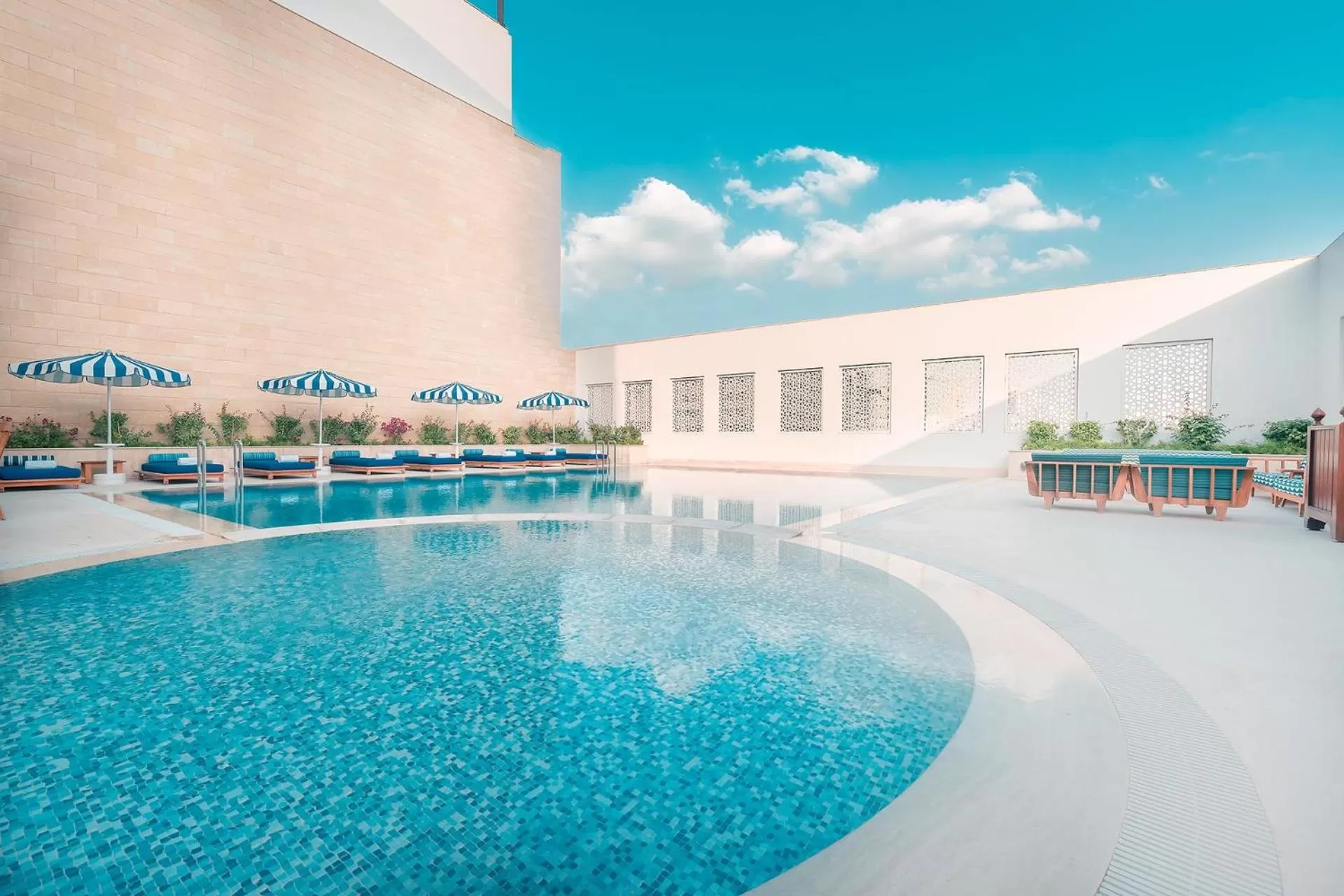 Swimming pool in Al Najada Doha Hotel by Tivoli