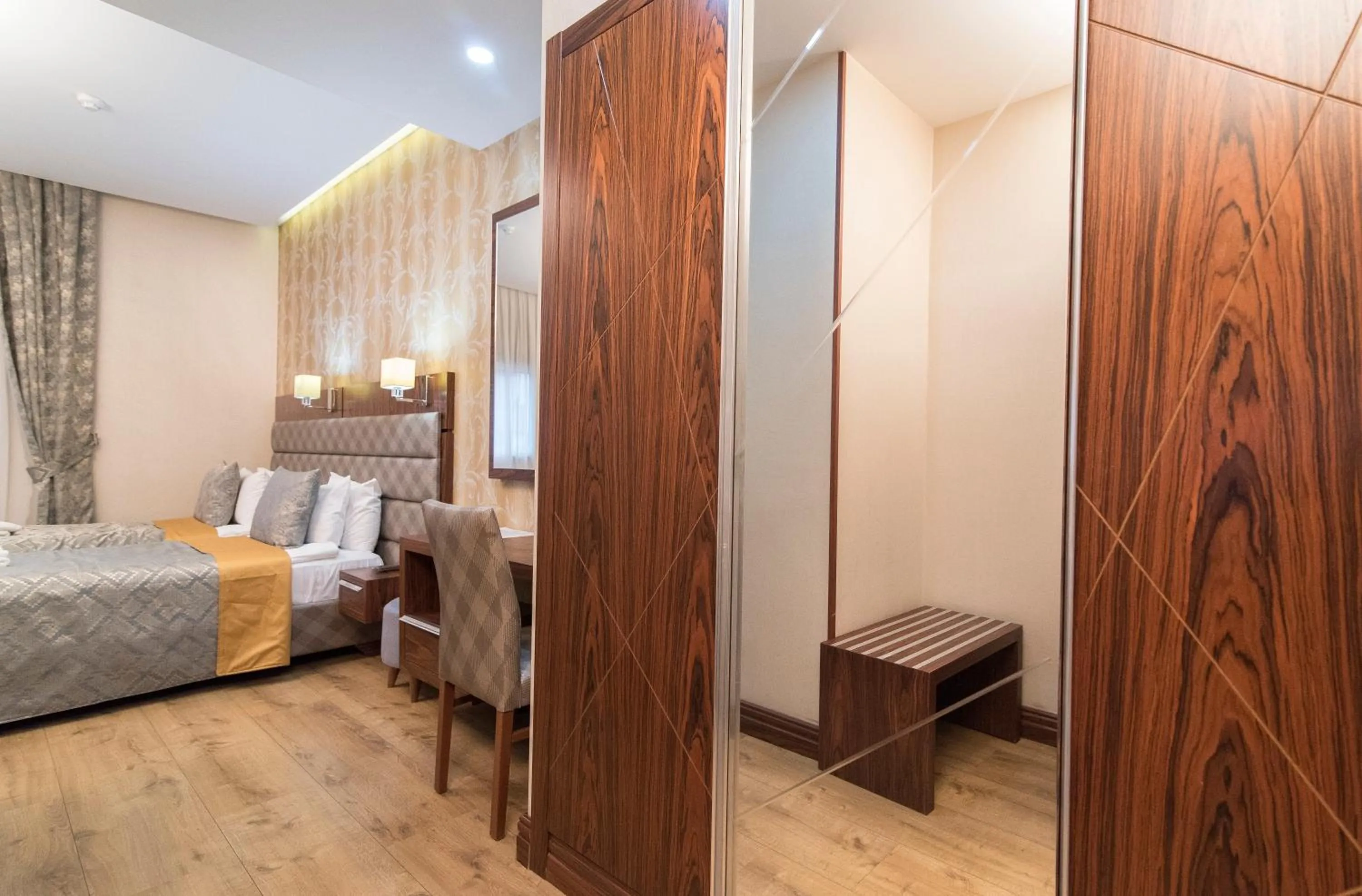 Bed in MidMar Deluxe Hotel