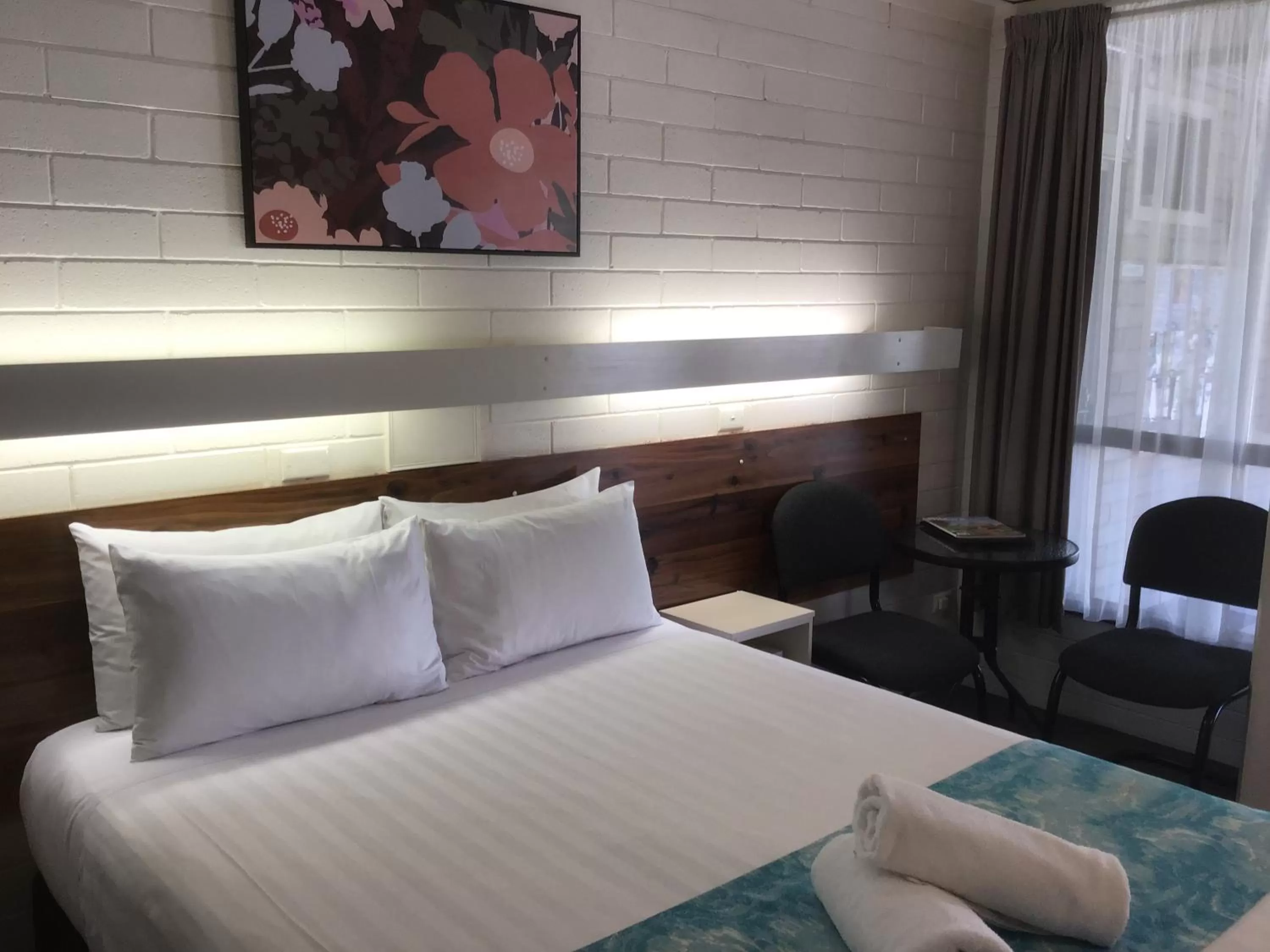 Bed in 7th Street Motel