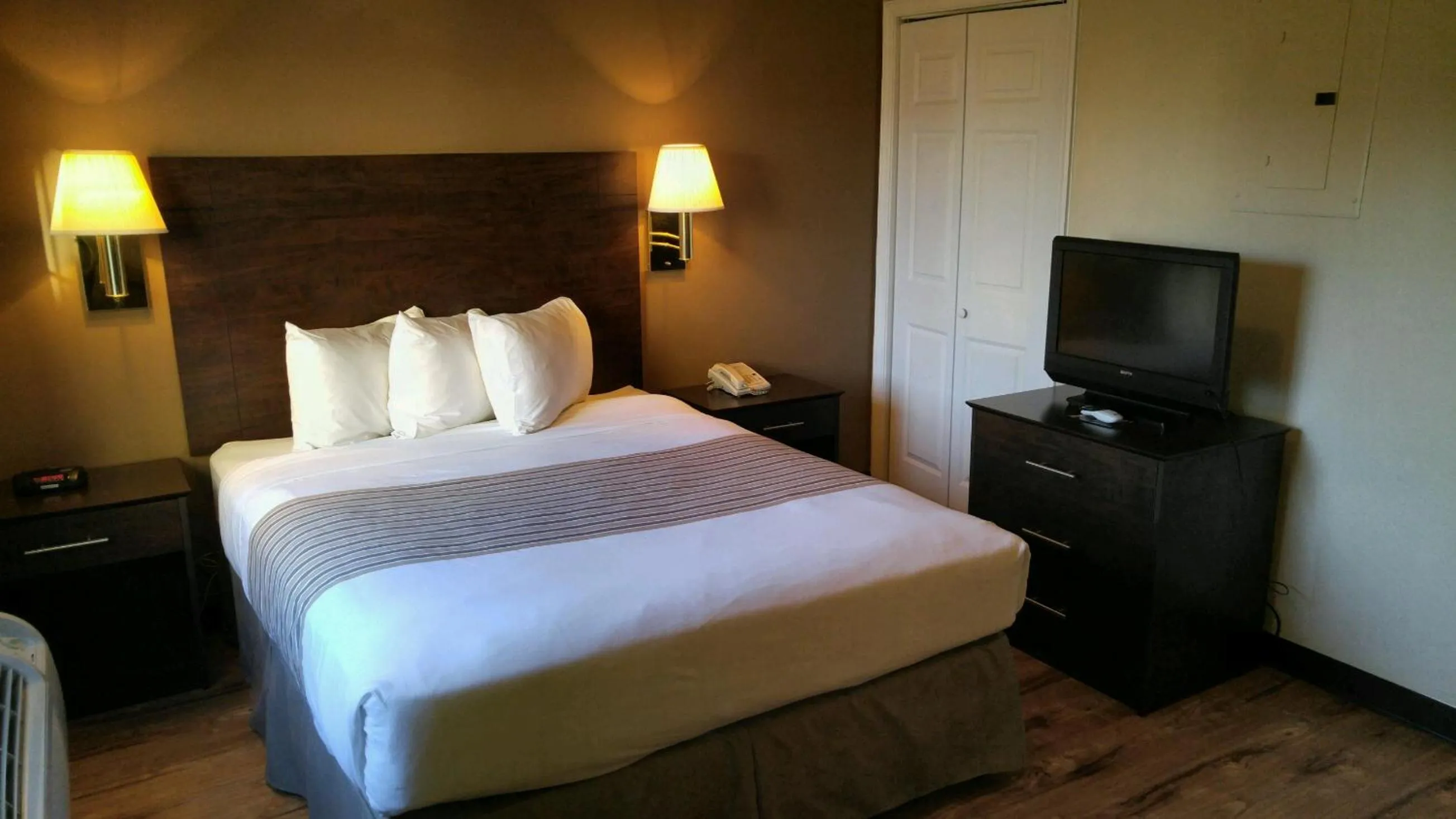 Bed in Suburban Studios near University of North Carolina-Charlotte