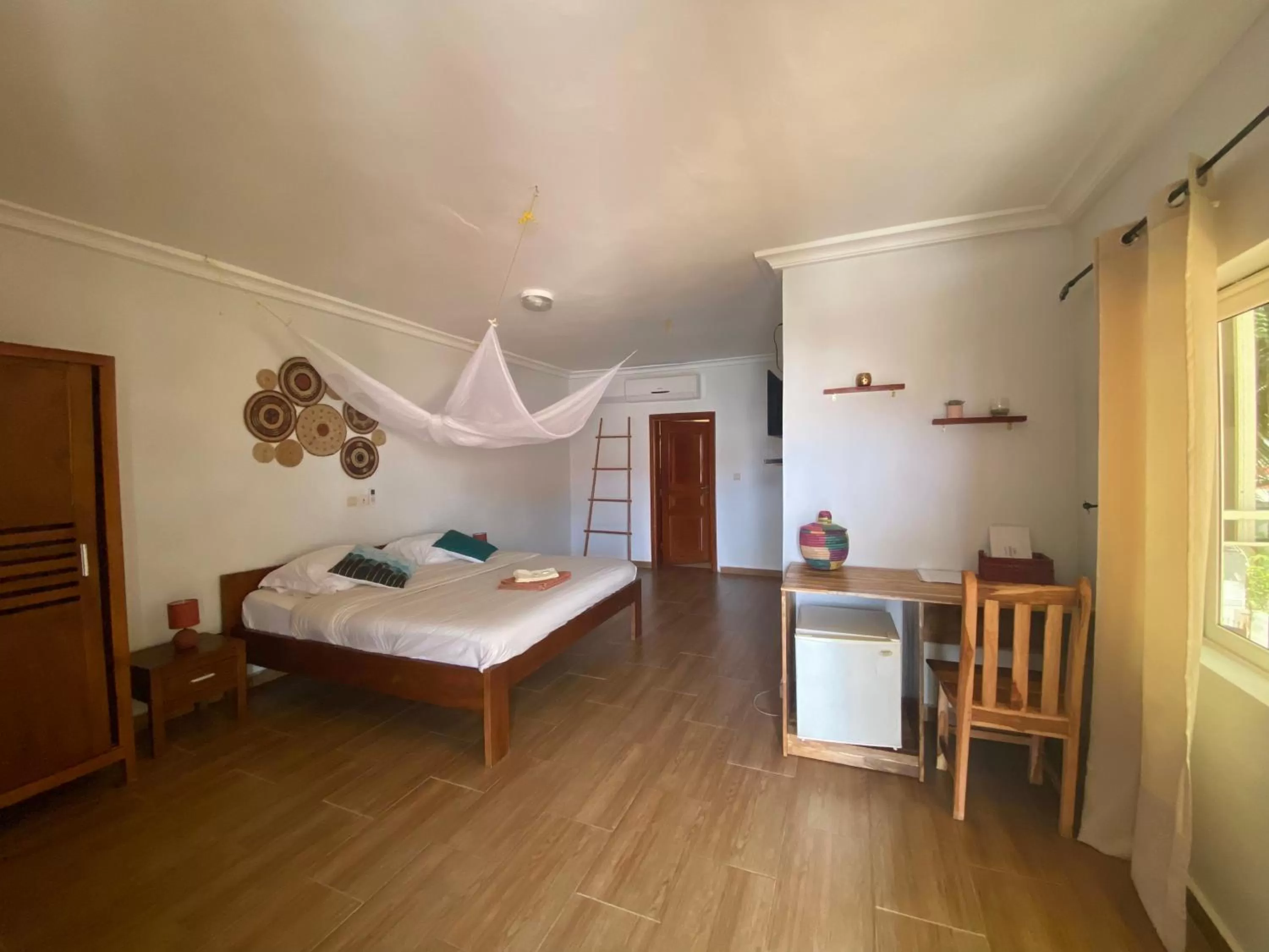 Bed in L'Oasis Guesthouse