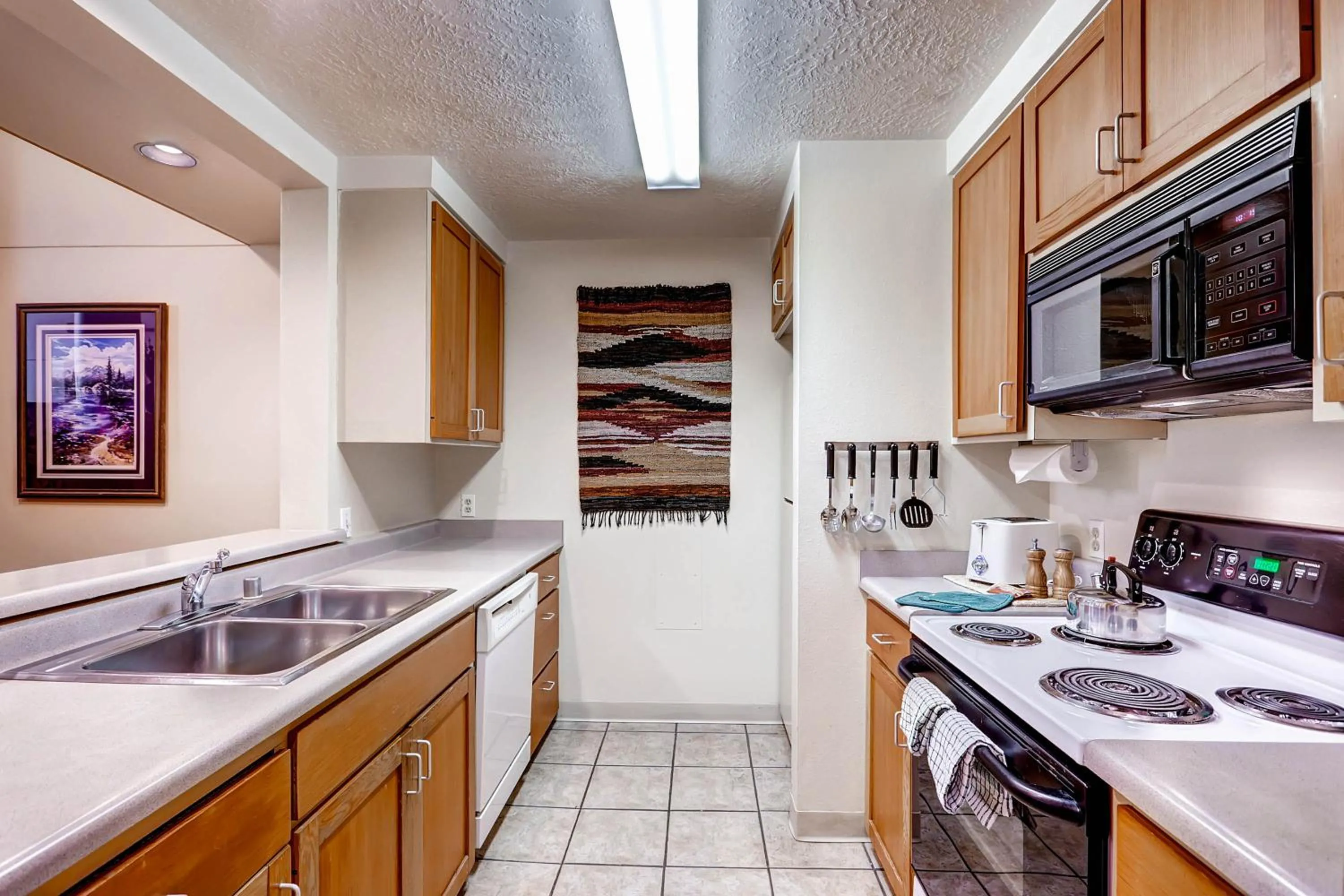 Kitchen or kitchenette in Evergreen Condominiums by Vail Resorts