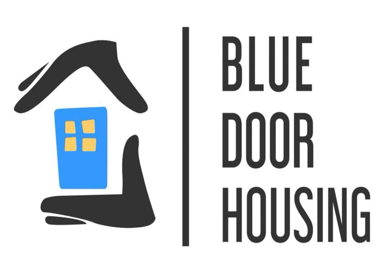 Logo/Certificate/Sign in Blue Door Housing Historic Quito