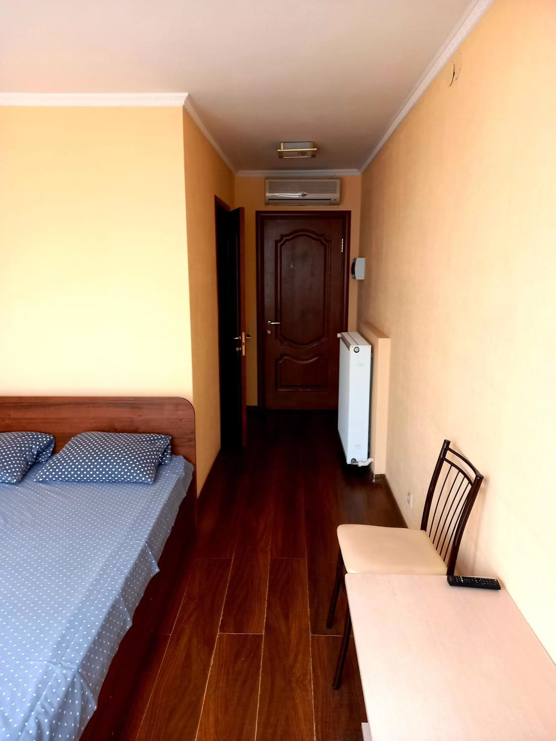 Bed, TV/Entertainment Center in Rodina Hotel