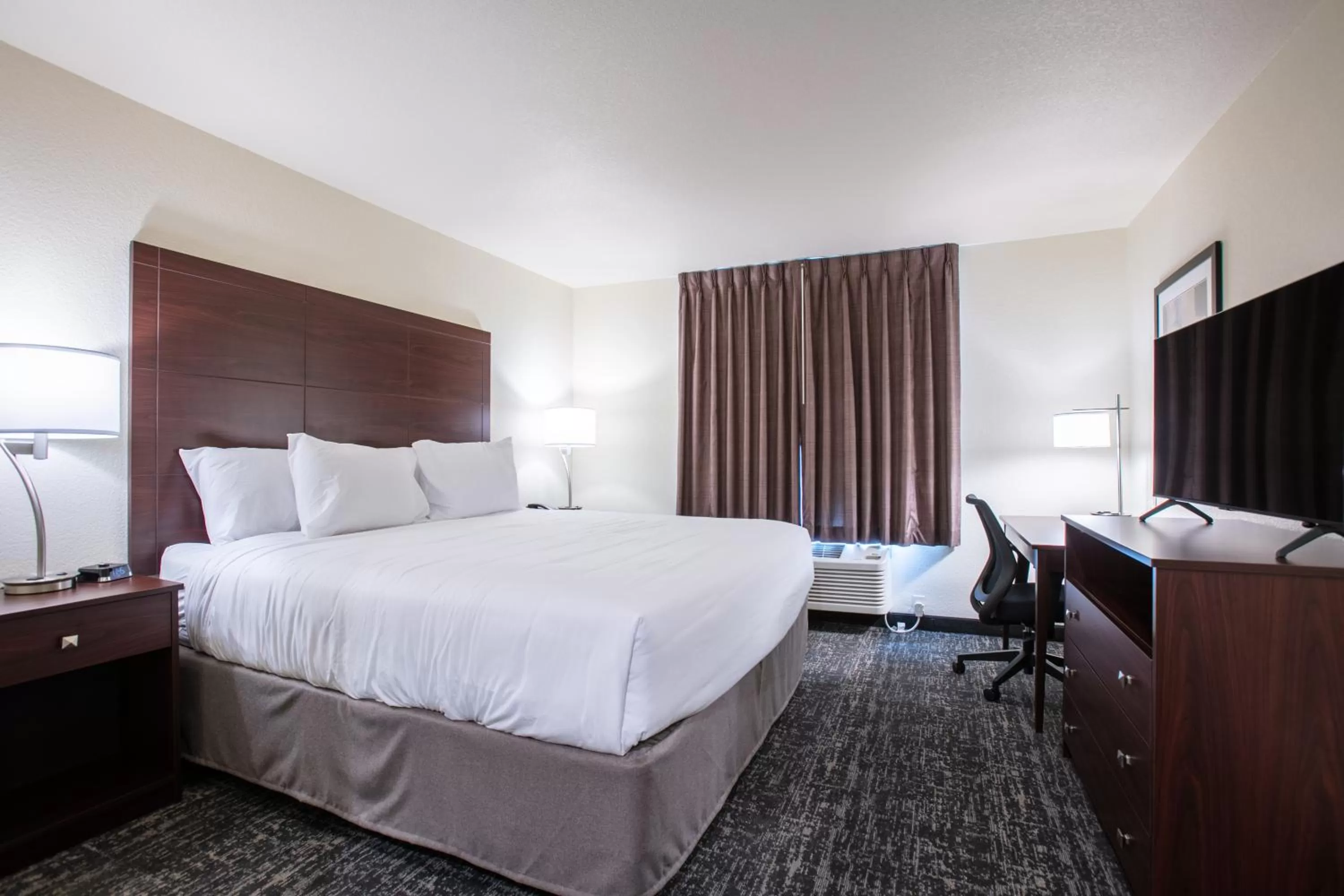 Bed in Cobblestone Inn & Suites - Pine Bluffs