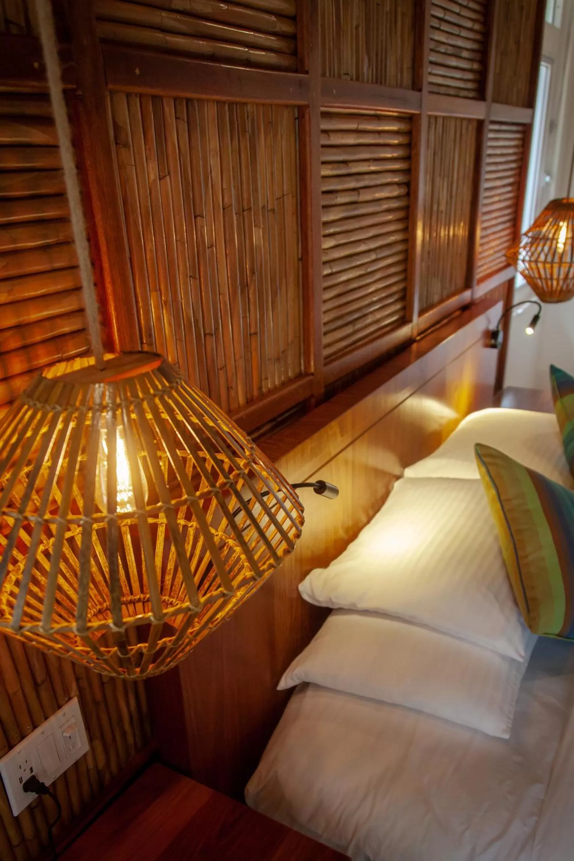 Bed in Sleeping Giant Rainforest Lodge