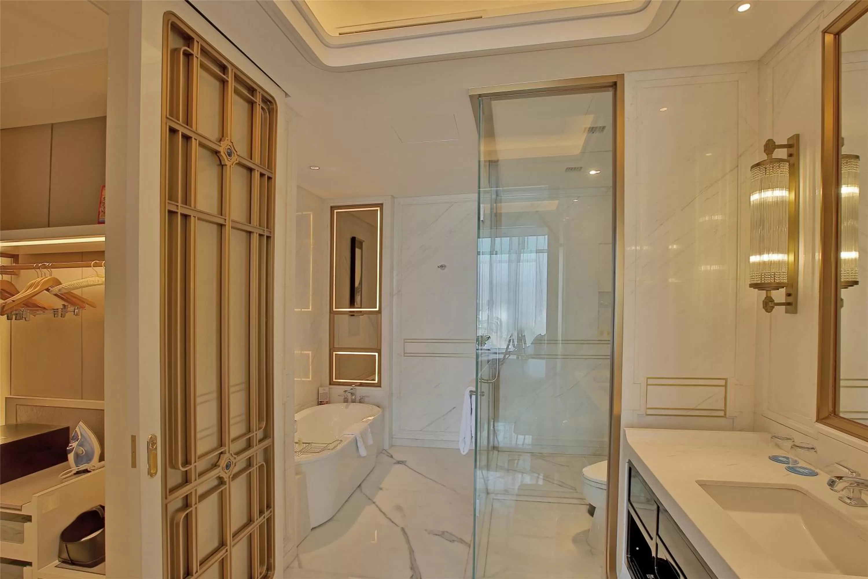 Bathroom in Wyndham Qingdao l Free Fixed-Time Shuttle Service Between Hotel and Airport & North Railway Station l Outdoor Children's Amusement Park l 1-Hour Play Snooker or Table Tennis